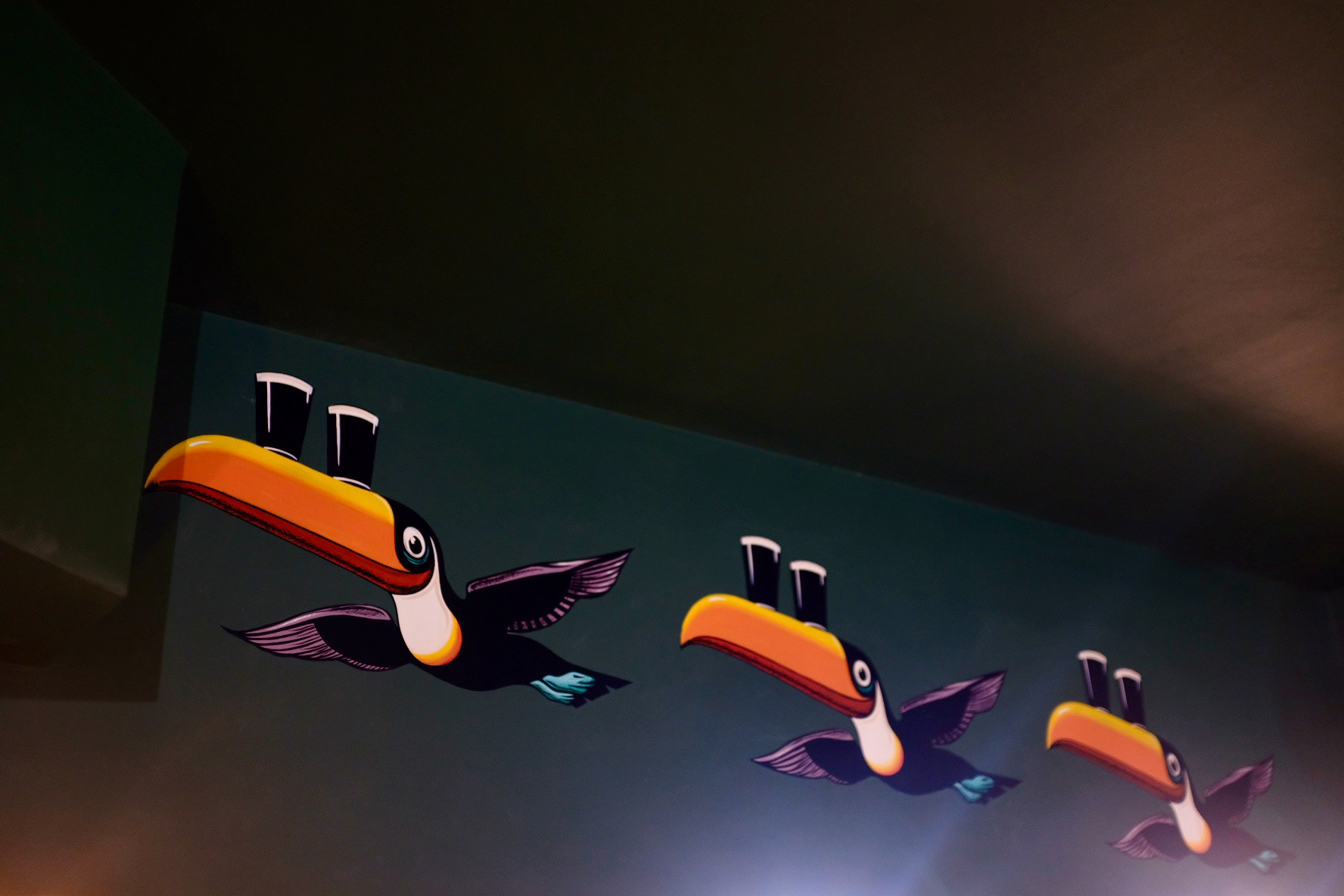 Hand painted Guinness toucans by Leah Pendleton