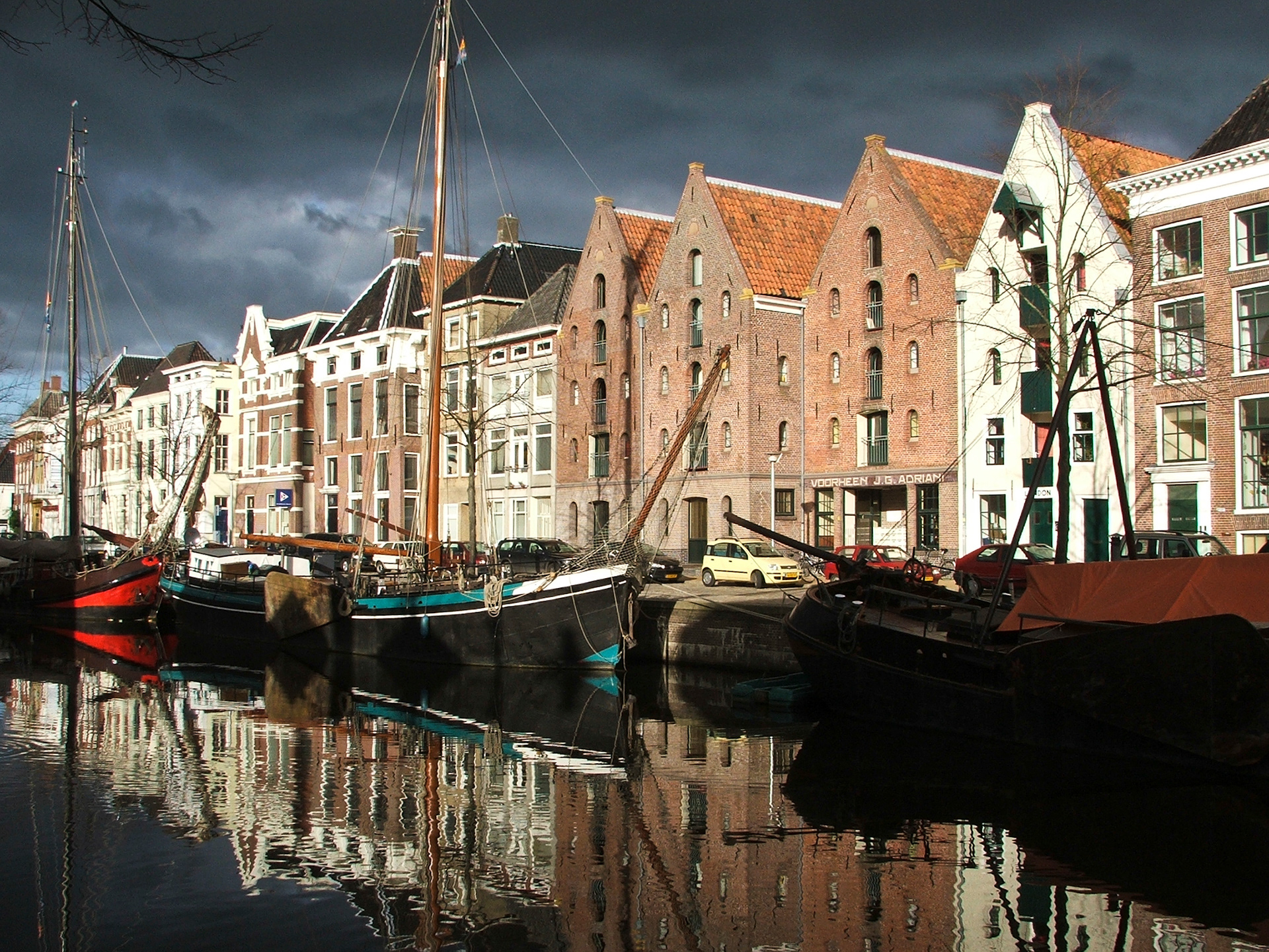 The centre canal of Groningen, with historic sailing boats