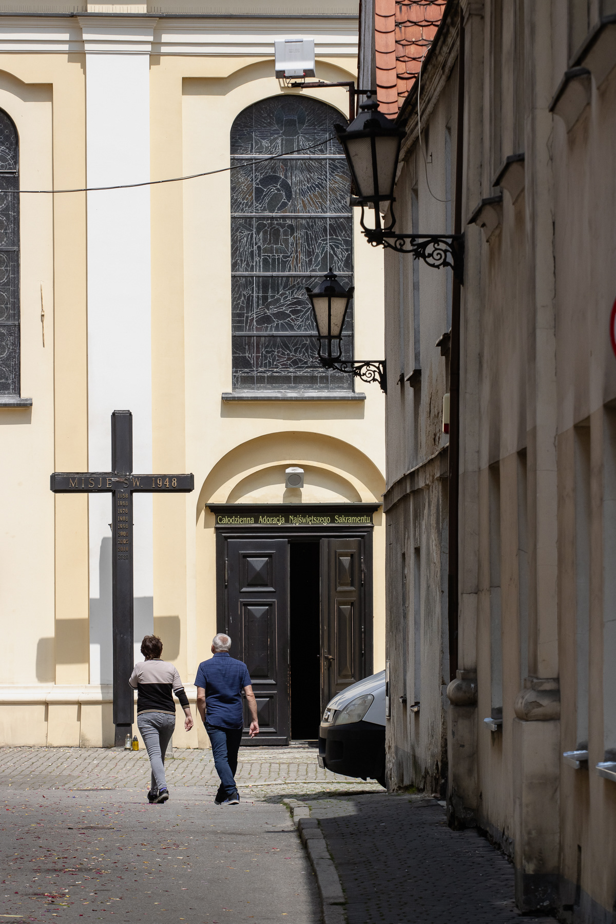 Alley to the catholic church with its dominating bell tower.