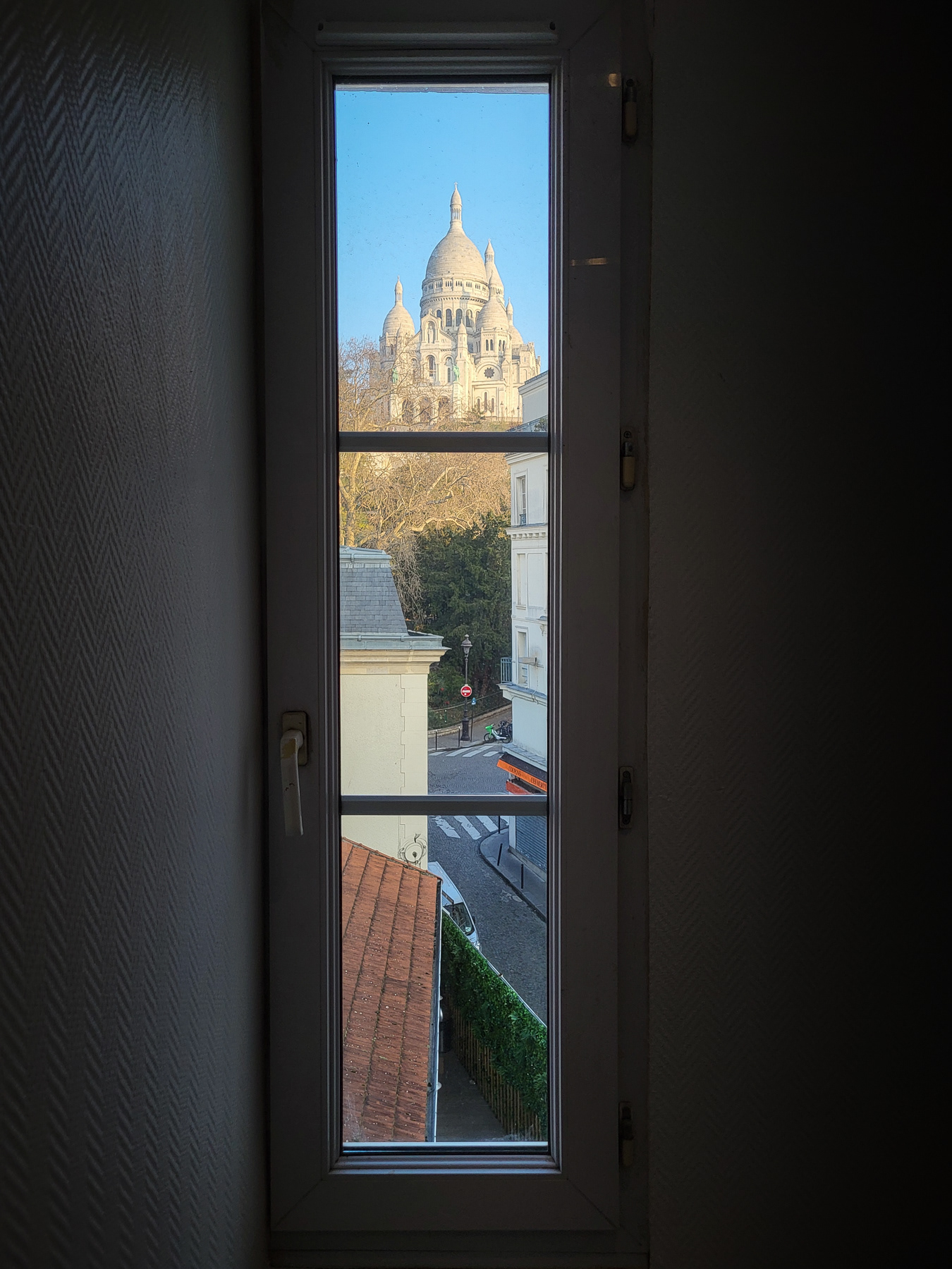 View at the  Sacré-Cœur from a staircase, March 2023.