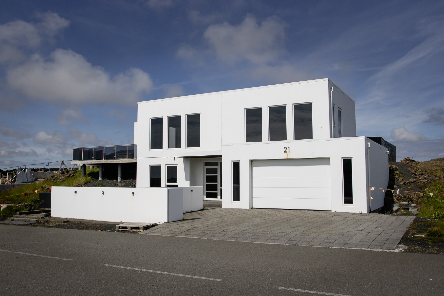A brand-new villa survived the lava stream barely, yet is left dormant like so many of the new homes in this residential area of Grindavik.