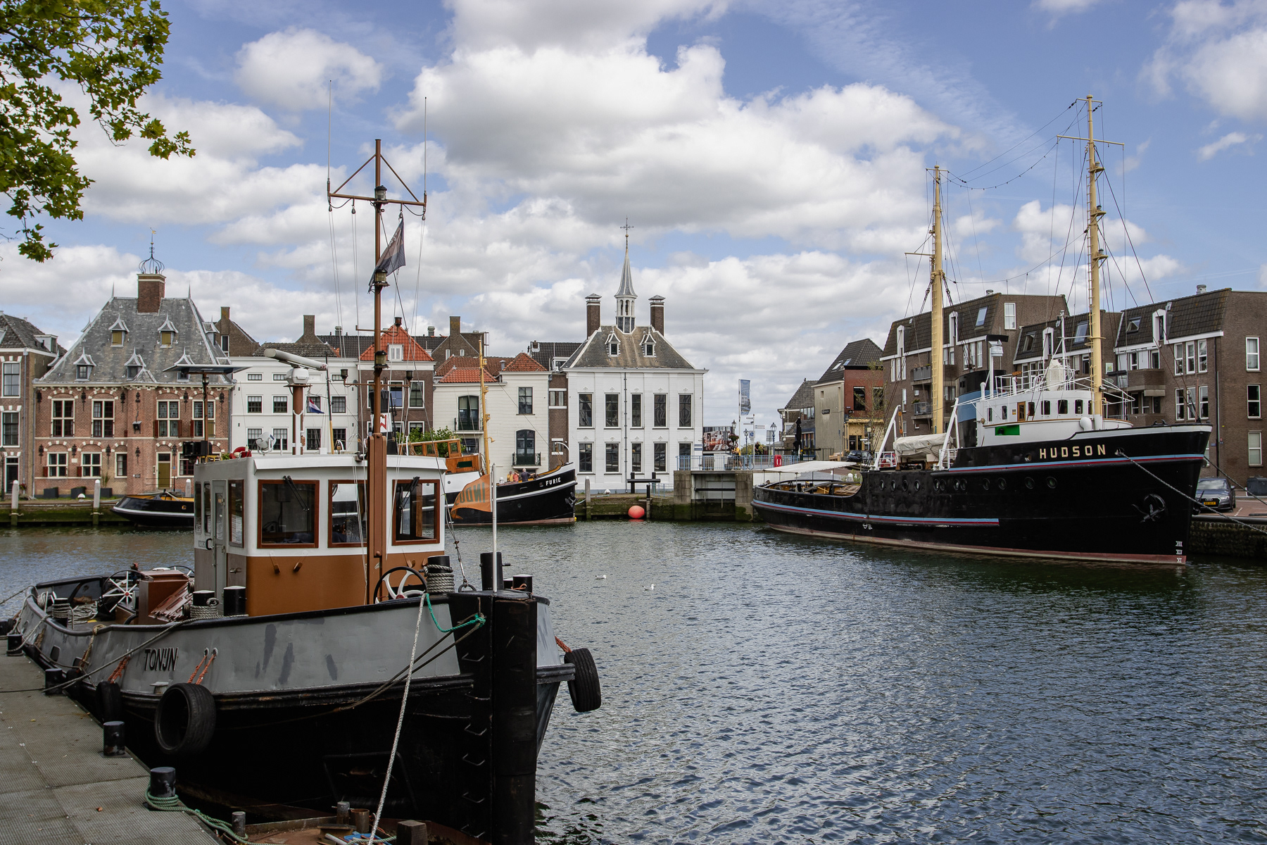 Historic boat Tonijn and the ships Hudson and Furie in the inner harbour of Maassluis