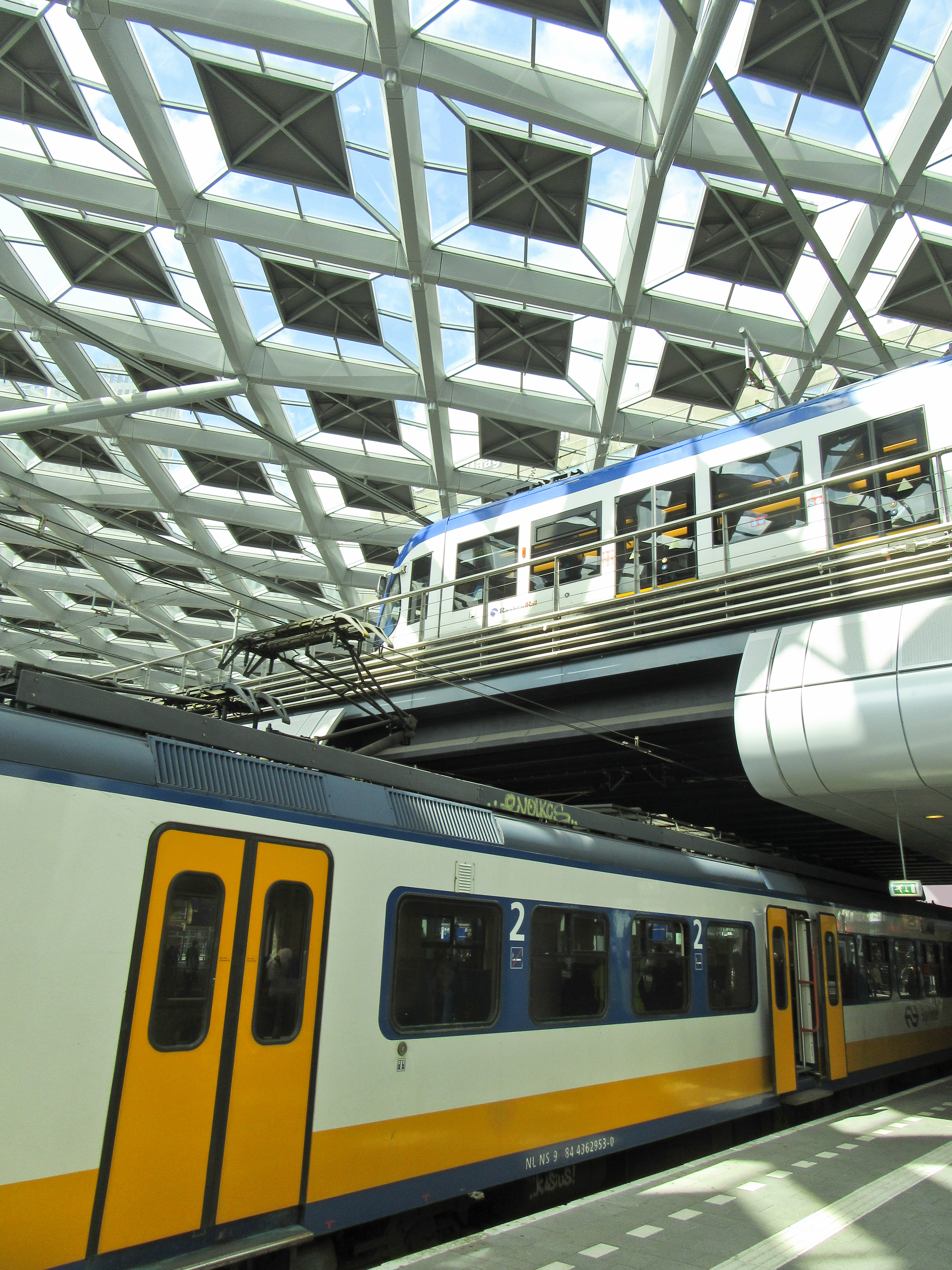 Trains on ground level and trams above, August 2016.