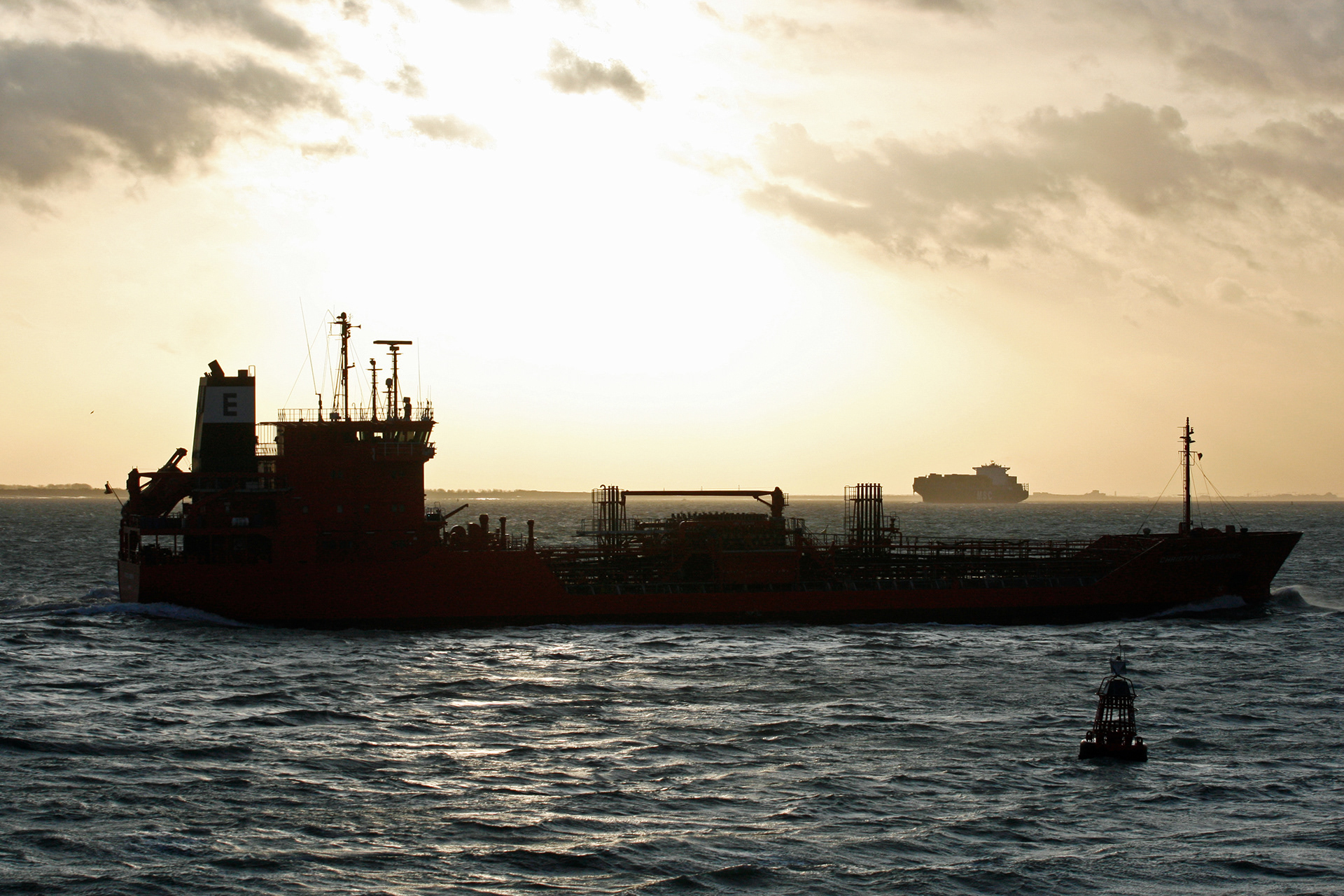 Ship silhouettes at sunset in the Westerschelde