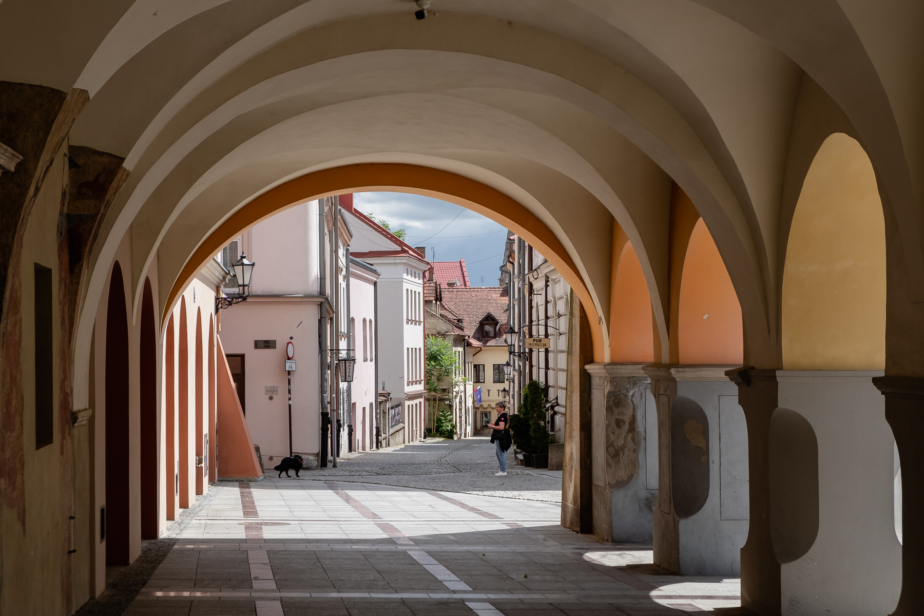 The arched walkaways around the main square of Tarnów are typical for historical Polish towns.