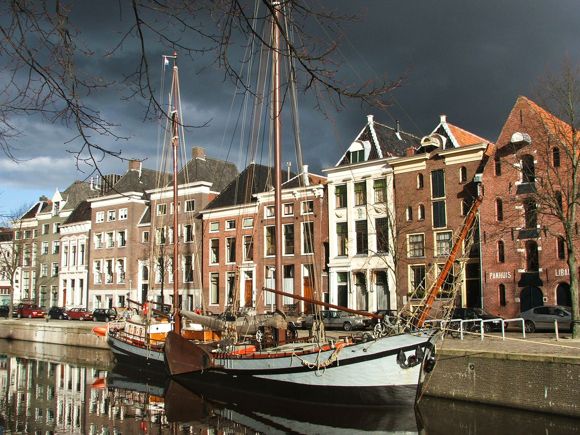 The centre canal of Groningen, with historic sailing boats
