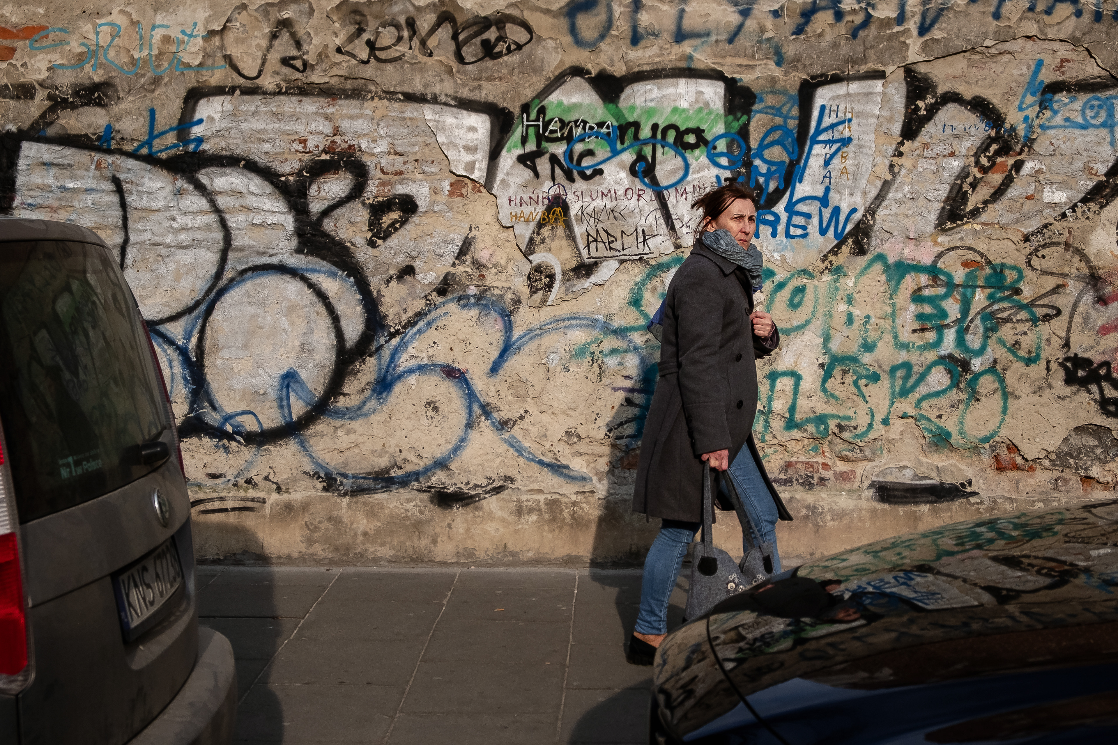 A passer-by in Bożego Ciała street.