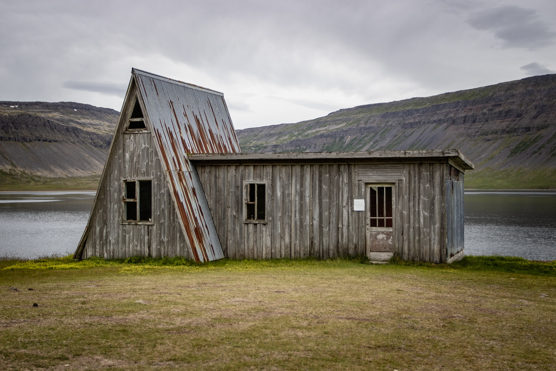 An abandonded A-shape house on the southern banks of the Patreksfjörður fjord.