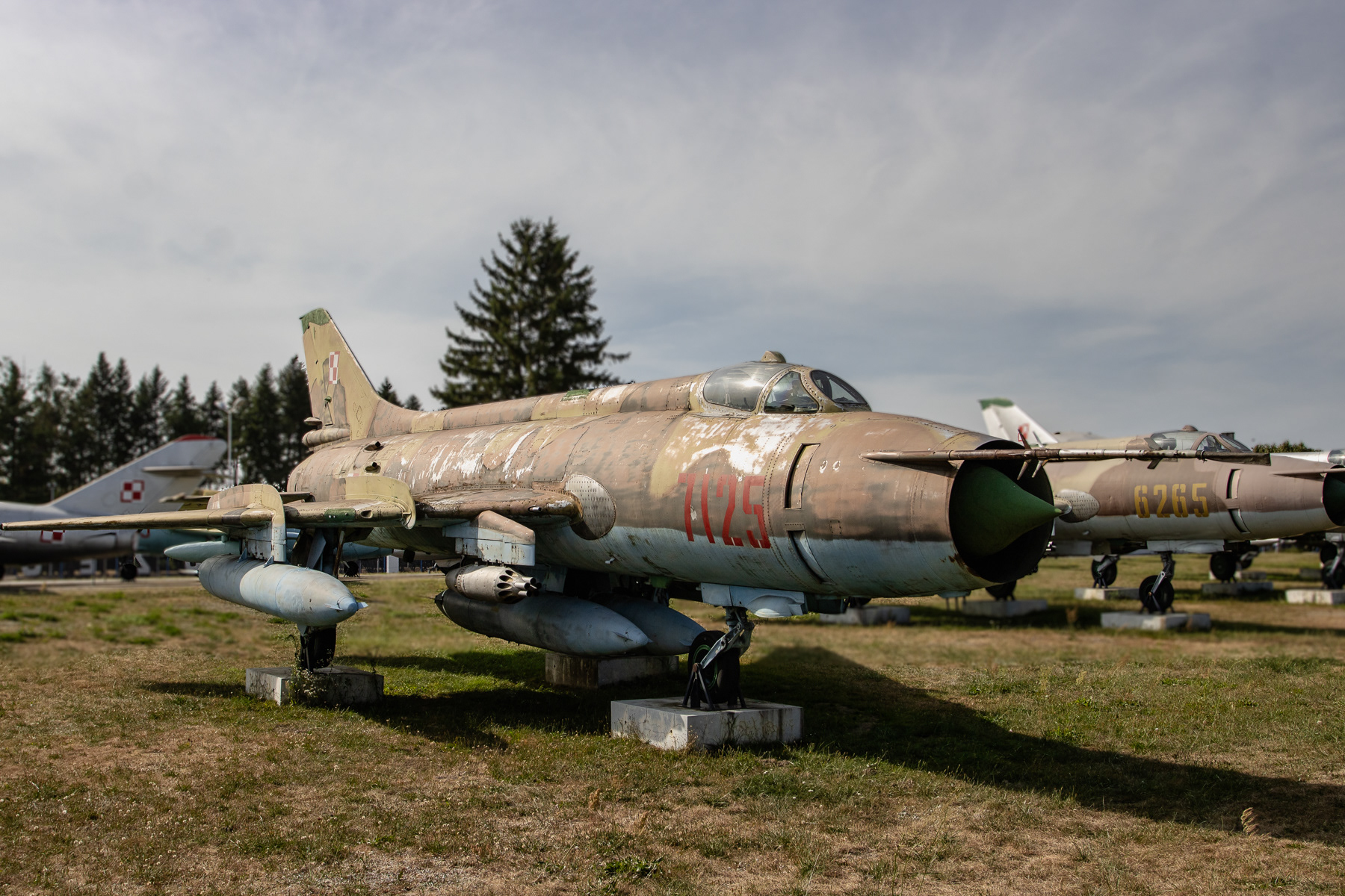 A pair of  Sukhoi Su-20 "Fitter" fighter jets. No. 7125 in front, followed by nr. 6265.