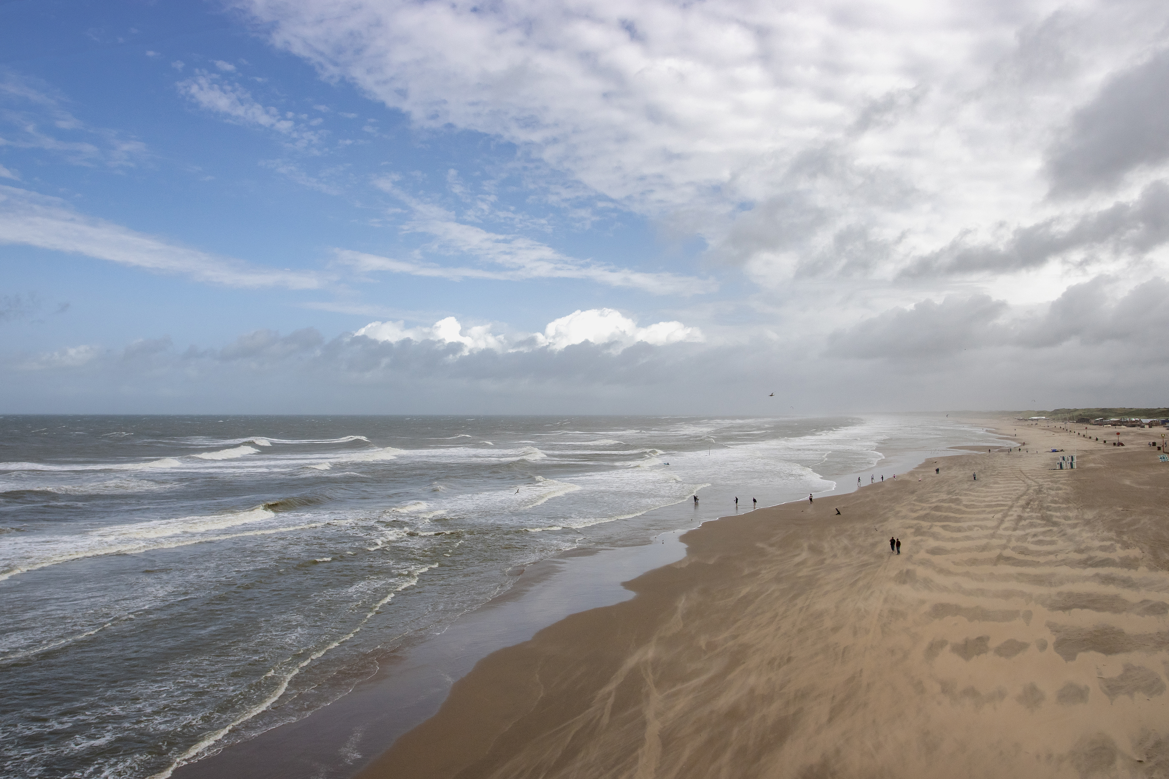 Scheveningen beach, seen from the pier. View towards the north on a windy August morning, 2024