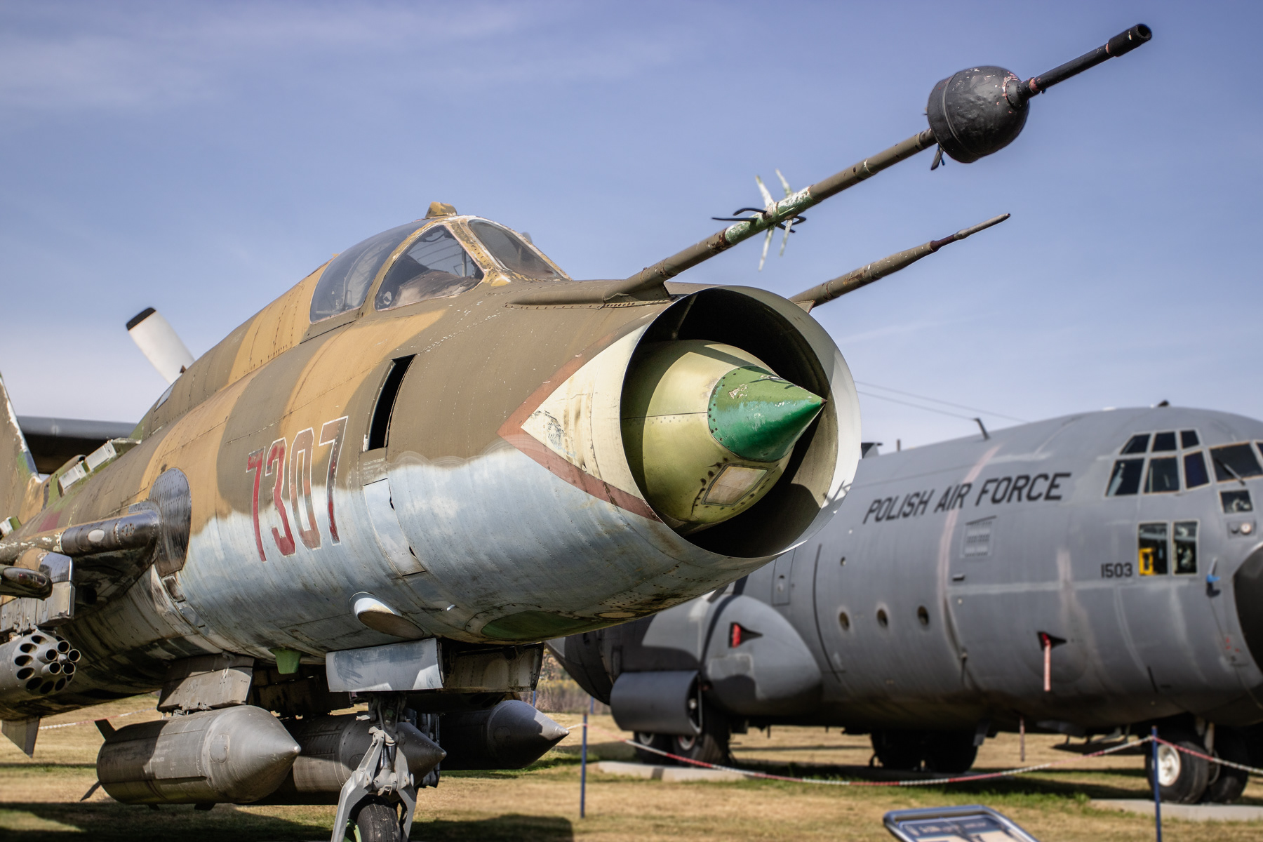 A Sukhoi Su-22 Fitter and a Polish Air Force C-130 Hercules at the Air Force Museum of Dęblin, Poland