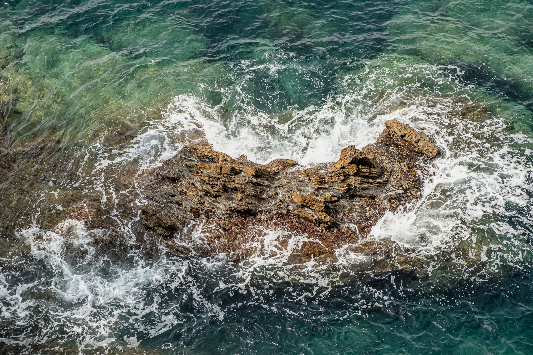 A rock in the ocean.