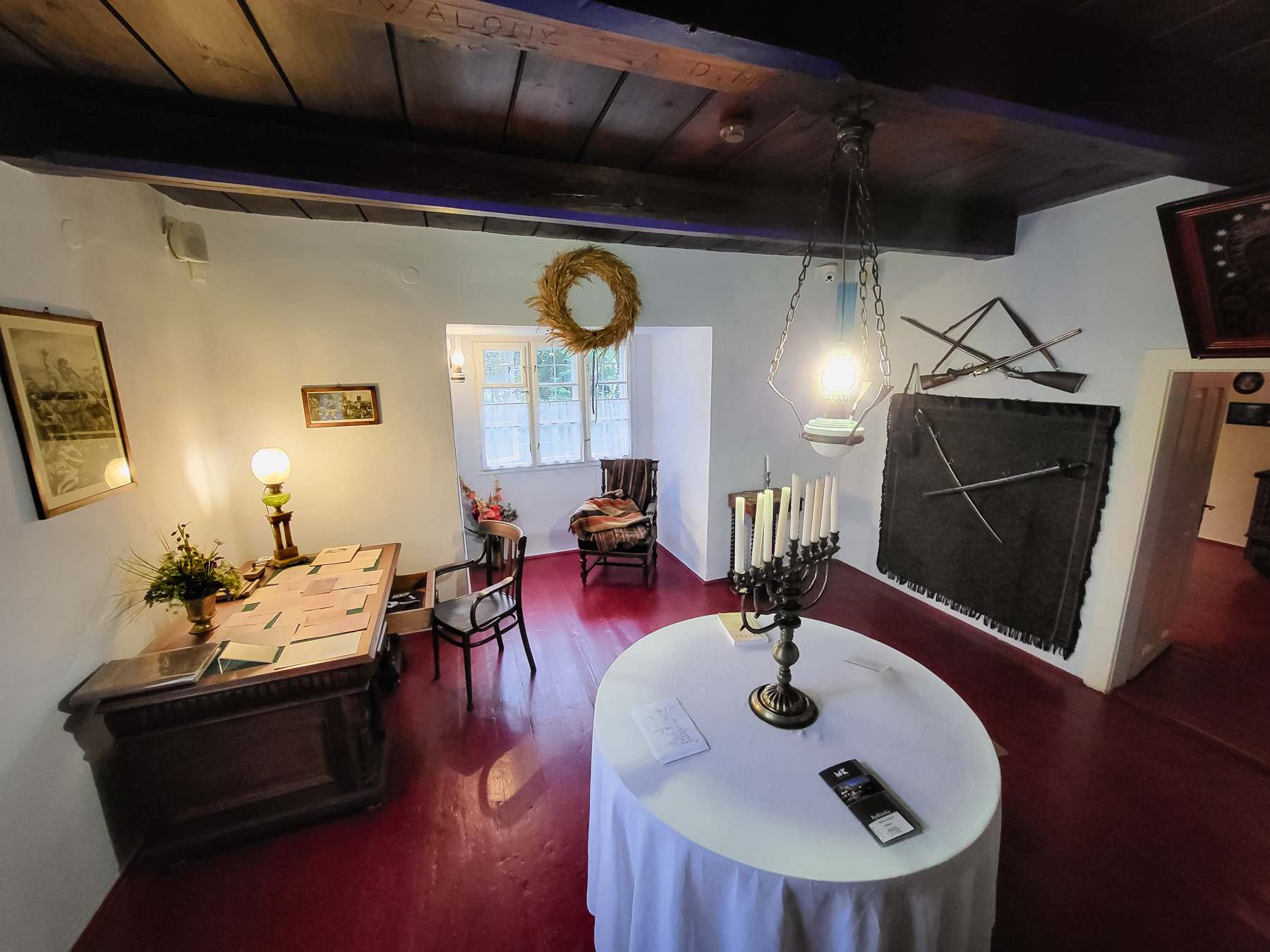 The room where older family guests were discussing life and everything, as it was in details described in the drama Wesele.