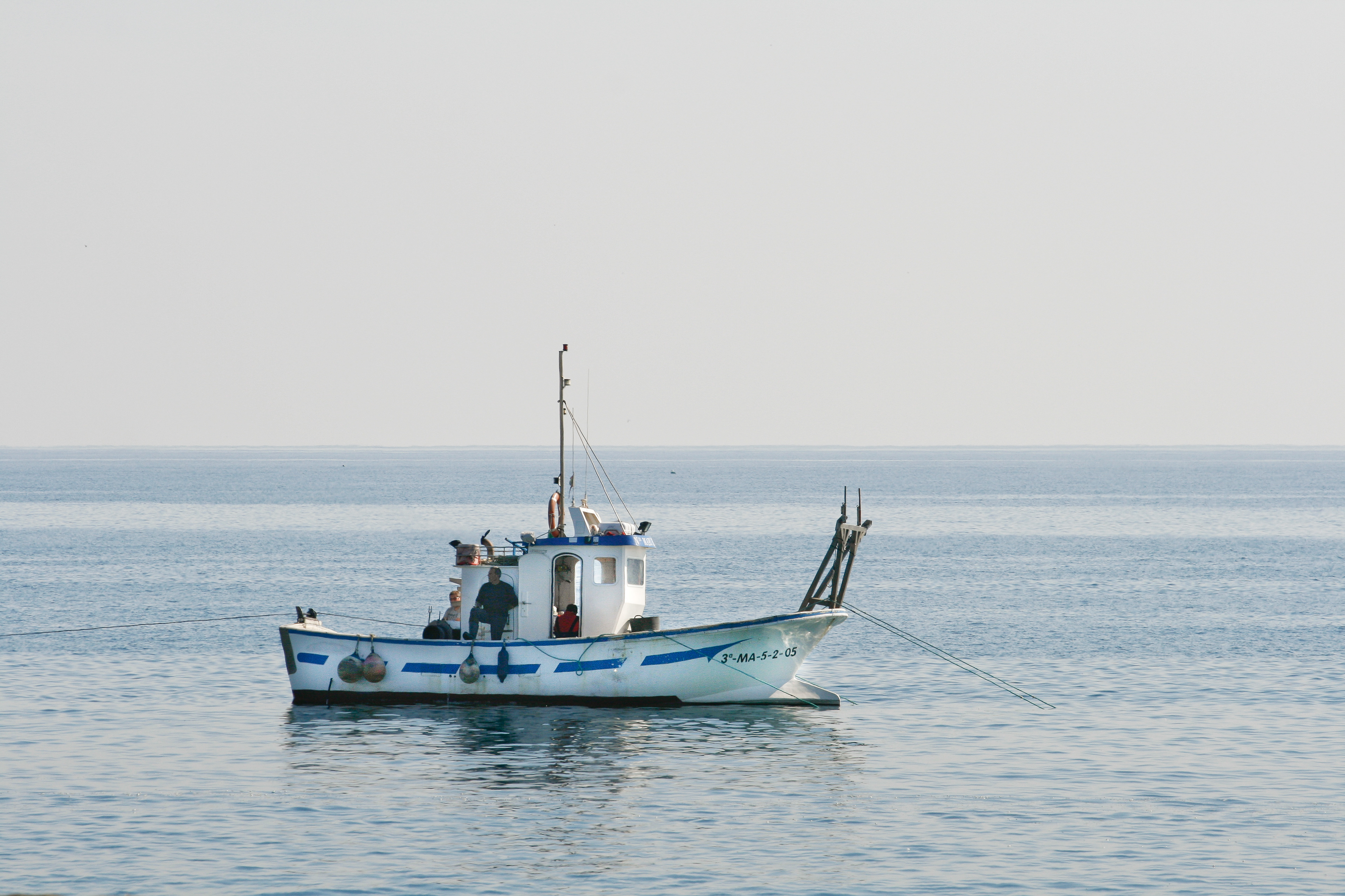 A small boat off the beach of Nerja, Andalusia, February 2018