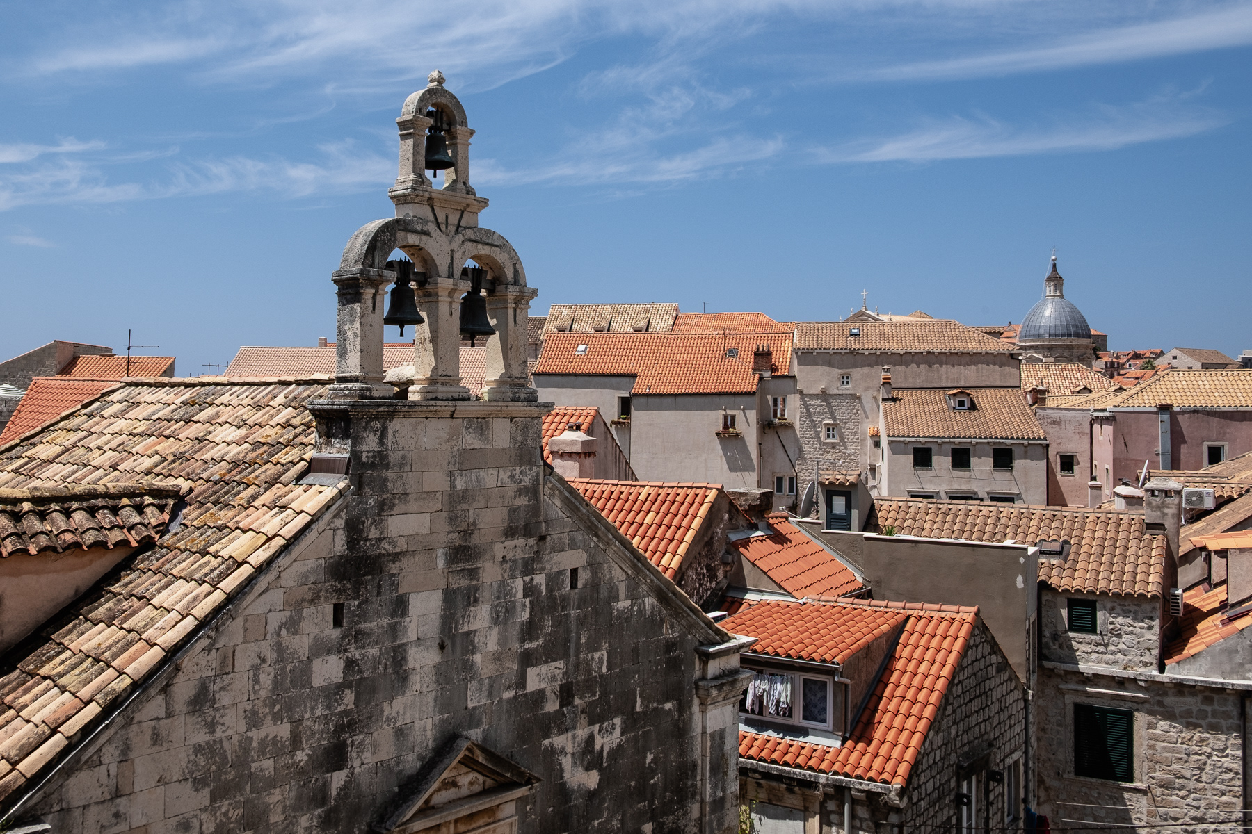 Belltower, church and rooftops, July 2023.