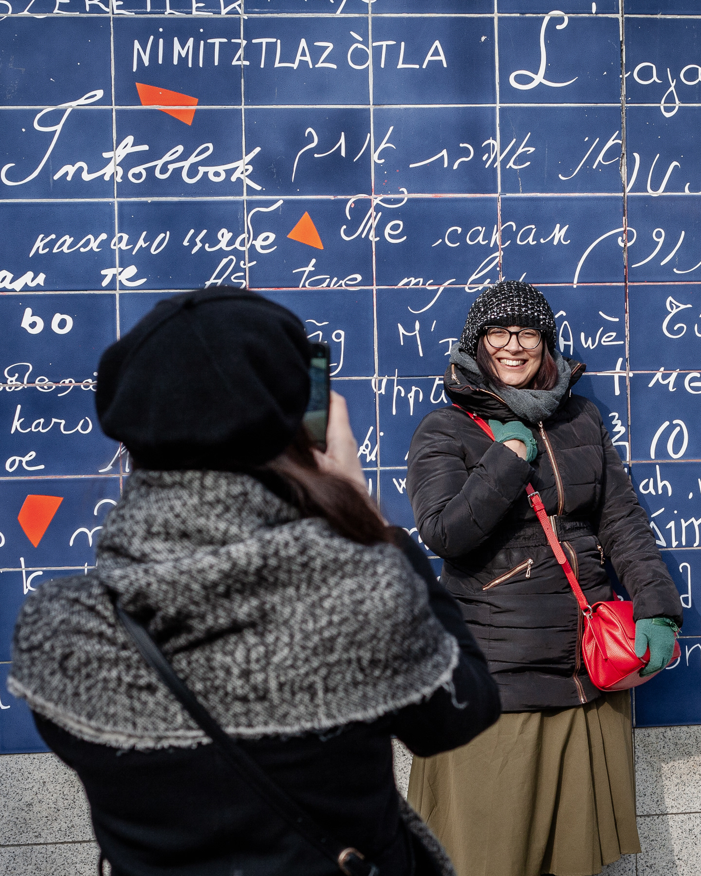 Smiling at the wall of love, March 2023.