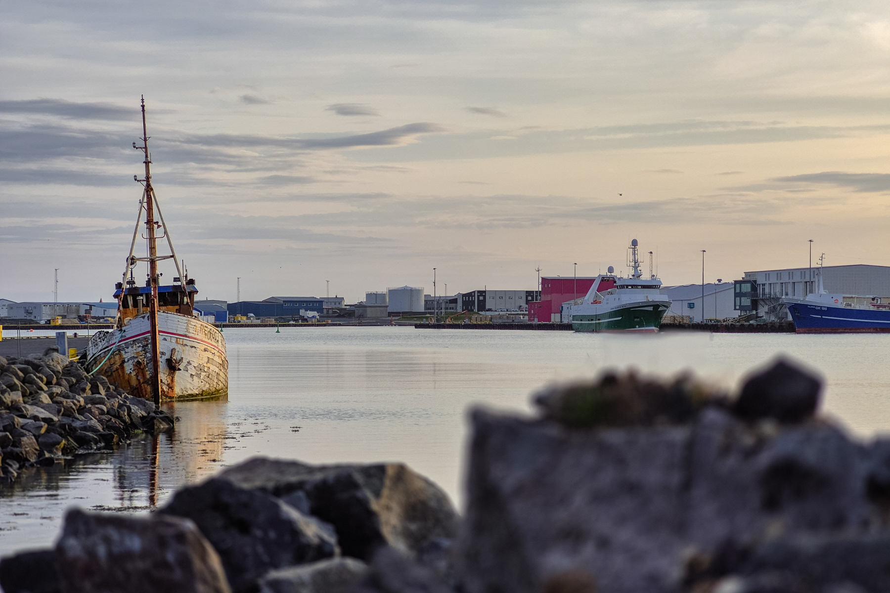 A rusty half decaying boat at one on the harbour quays. The harbour used to be buzzing with activity, judging older historic photos.