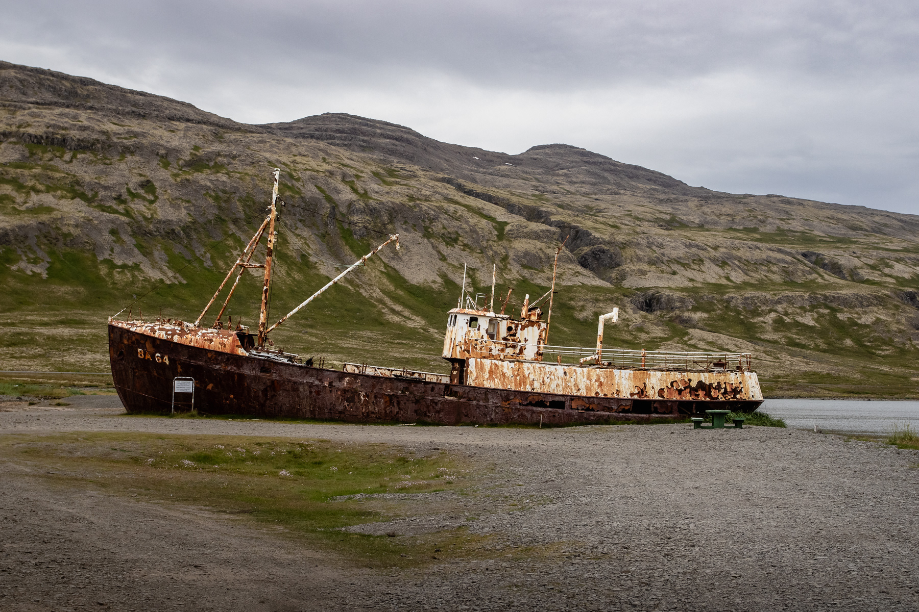 The Garðar BA 64 is the oldest steel ship of Iceland, made in 1912, and stranded at a Patreksfjörður beach since the beginning of the 1980s. It started its live in 1912, in Norway, as the Globe IV and was used for whaling. When the ship was deemed no longer safe, the owner let it be and that is where you find it rotting away today.