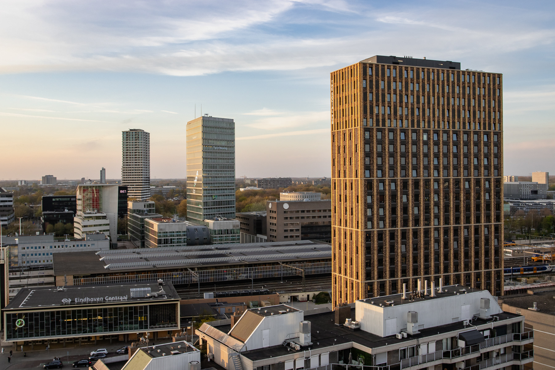 Eindhoven Central Station dwarfed by the nearby high rises.