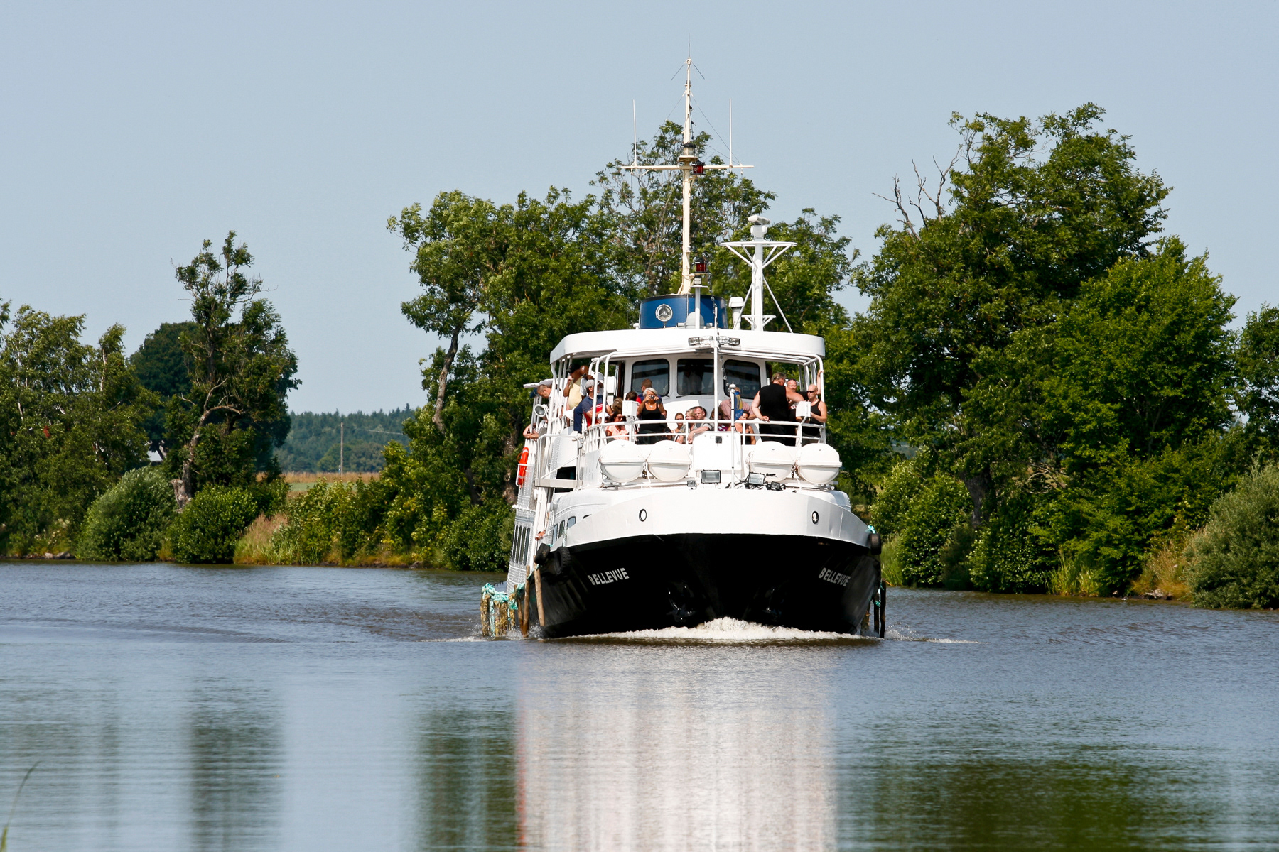 The Göta Kanal (Gothia Canal), the most impressive historic engineering accomplishment of Sweden seen here near Hajstorp. Passenger boat Bellevue cruising the canal. July 2013.