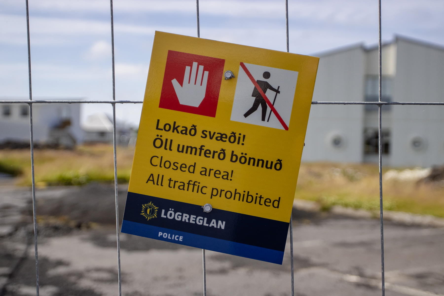 Fences marked with Police signs Closed area, all traffic prohibited, Grindavik, July 2025