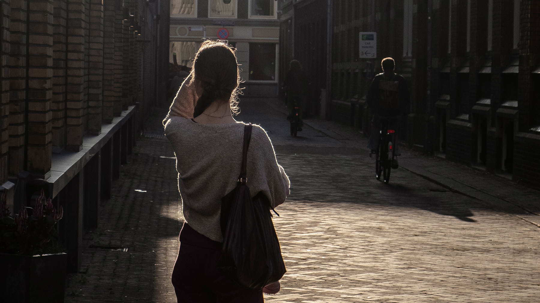 A halo around a young lady near the government buildigns in The Hague, October 2026.
