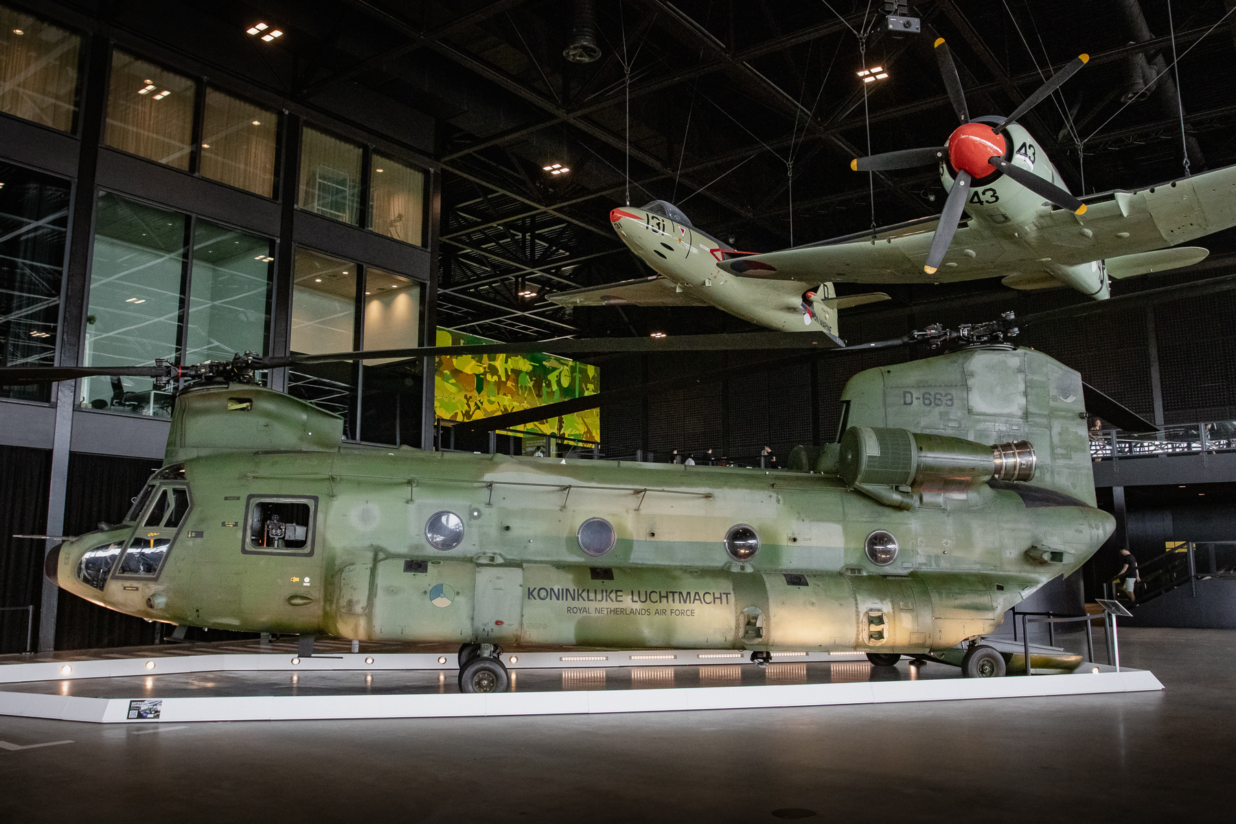 Royal Netherlands Air Force Boeing CH-47D Chinook (D-663) of 298 Squadron. At the National Military Museum, Soesterberg, the Netherlands. Above it on the left a Royal Netherland Navy Fleet Air Arm (Marineluchtvaardienst) Hawker Sea Hawk FGA-50 (top left) and the Marineluchtvaardienst Hawker Sea Fury FB.51.
