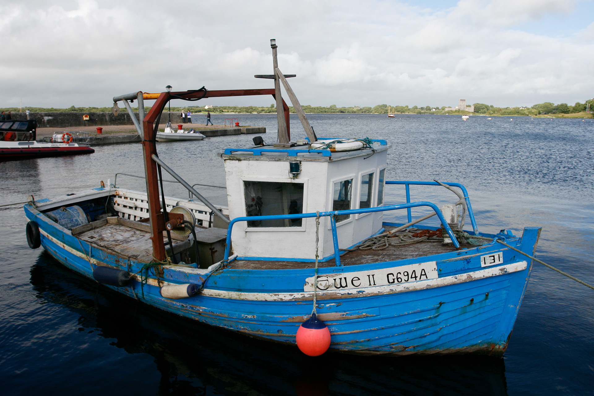 A cute small blue and white fishing boat callled Ewe II