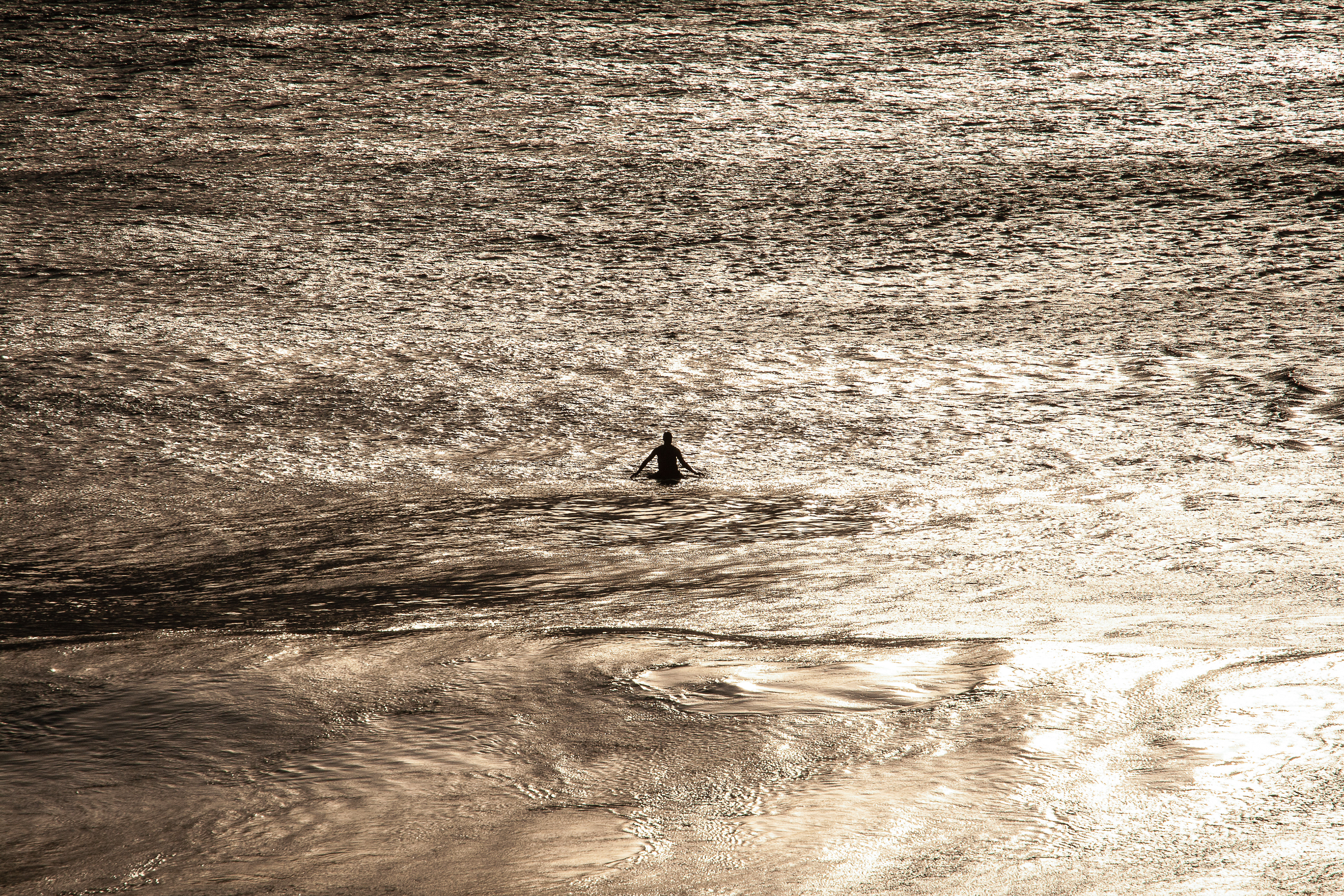A lone surfer in the surf of Jarmin do Mar