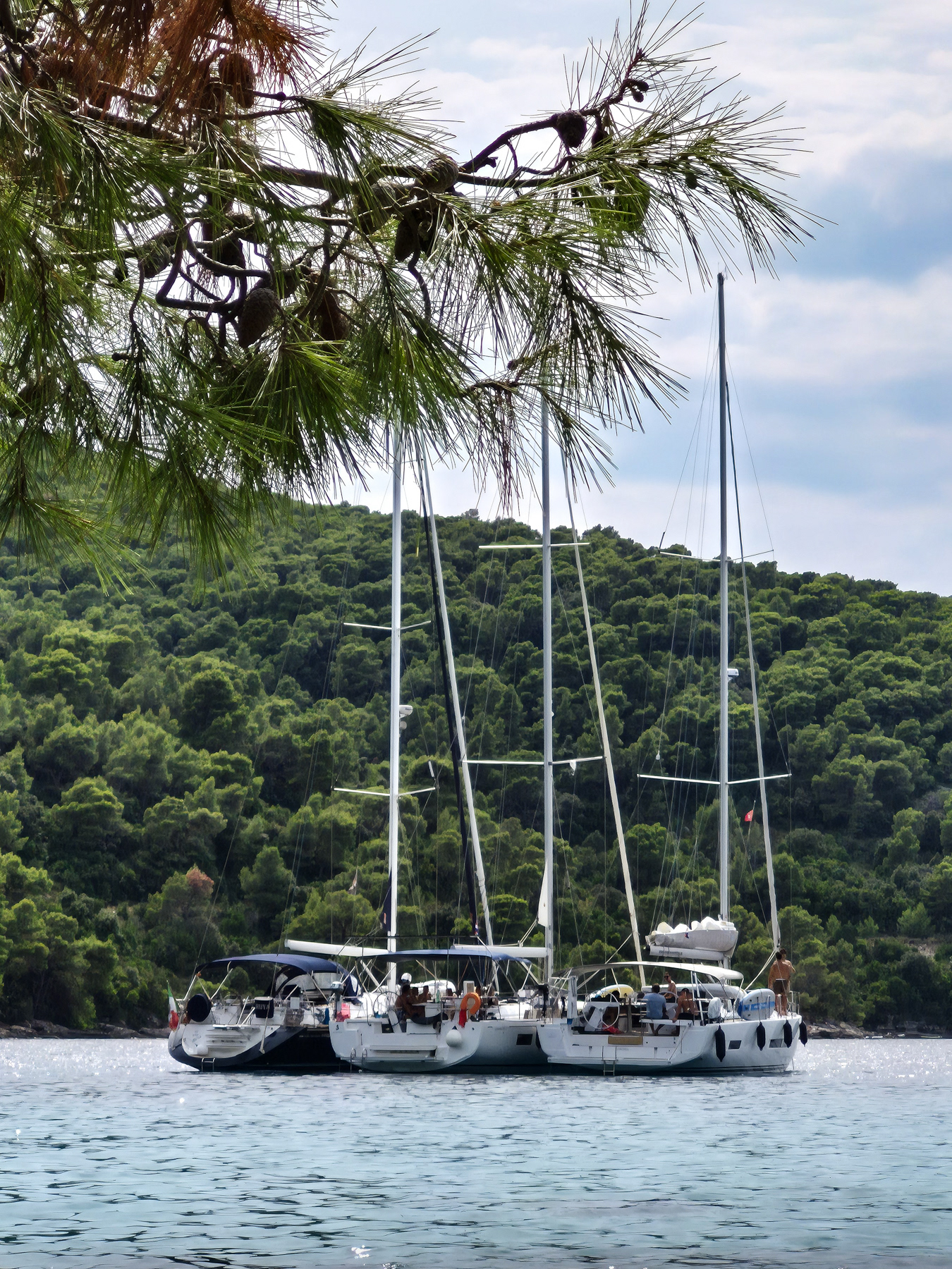 Small sailing boats show up in the bays all the time for their overnight stay.