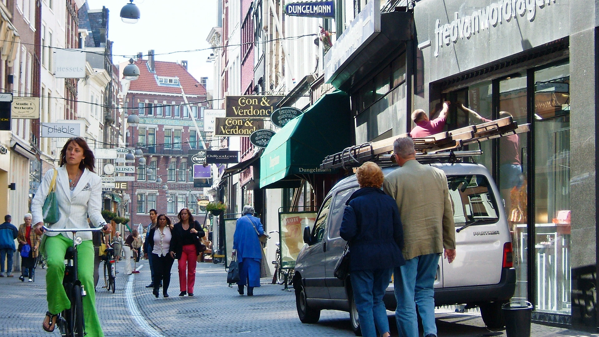 Apart from fashion and some signs, nothing much else has changed in the Hoogstraat (High Street)