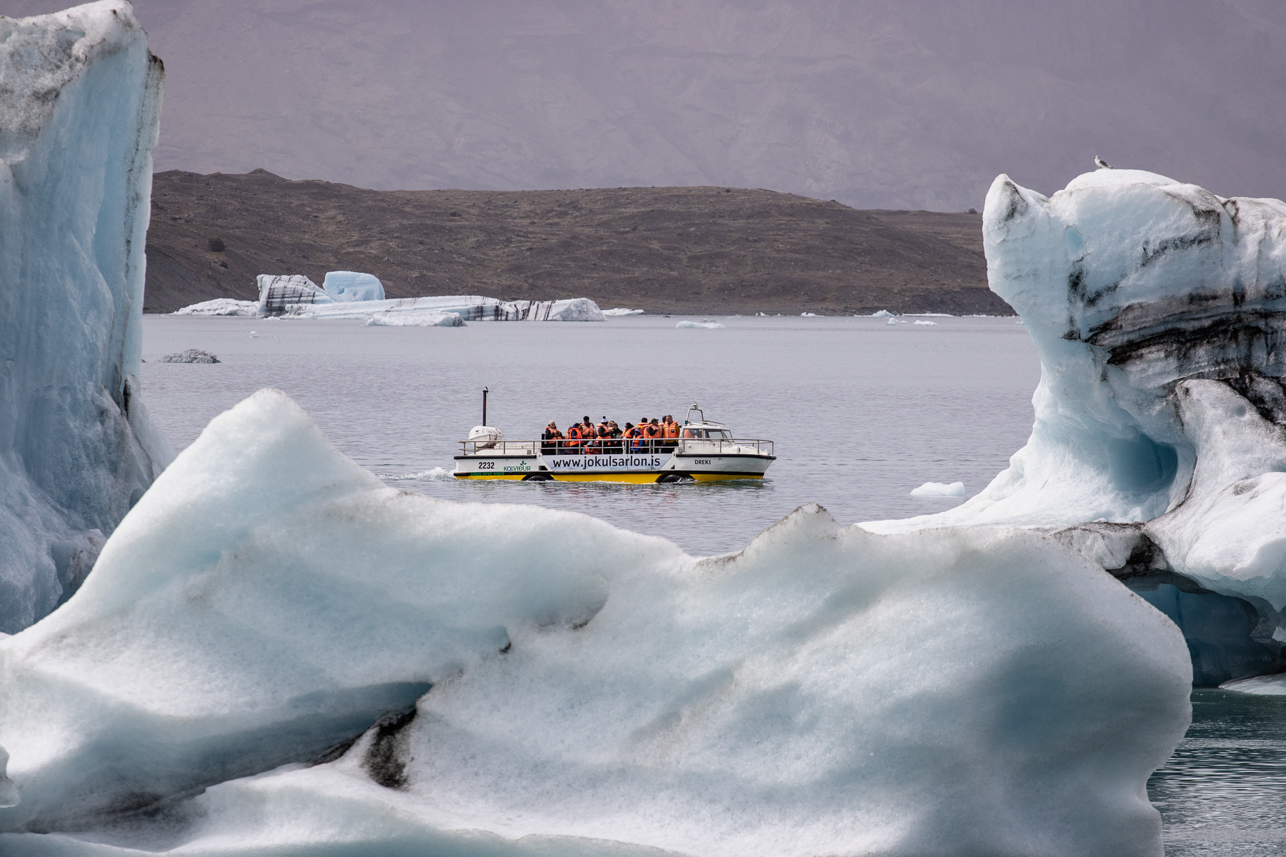 An amphibian with tourists cruising the glacier lake.