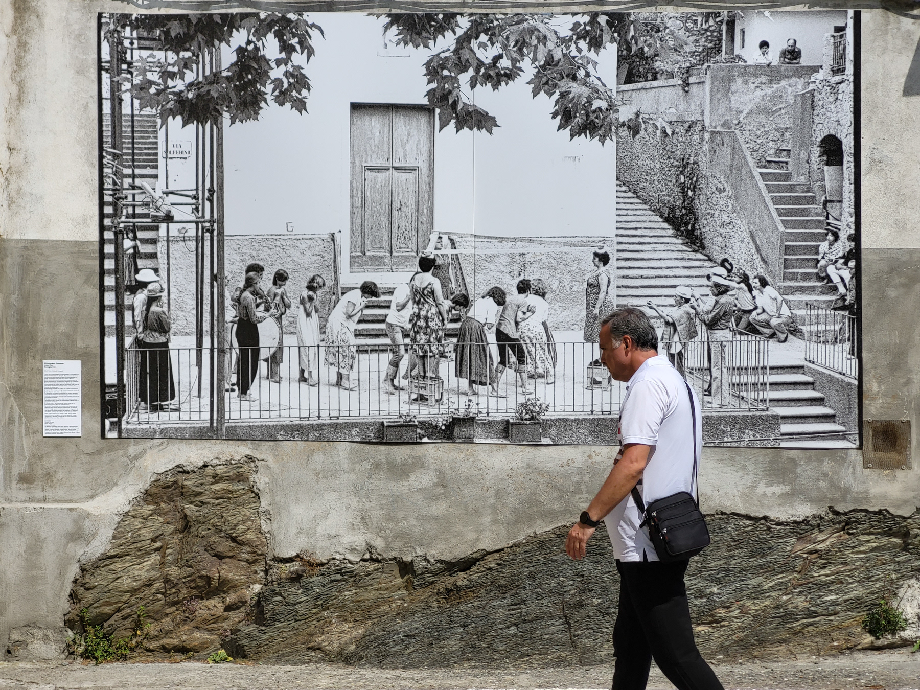 Anno Uno, a photo from Corniglia in 1981 by Paolo Pellion di Persano on a wall. 