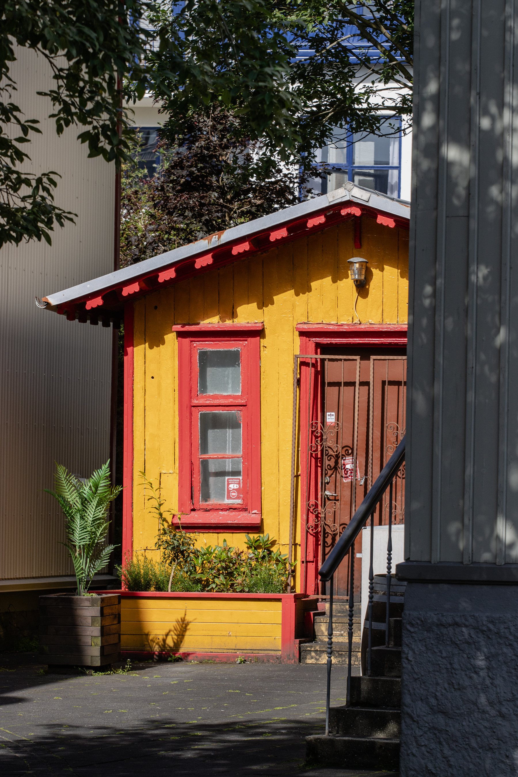 A yellow cabin in the city centre.