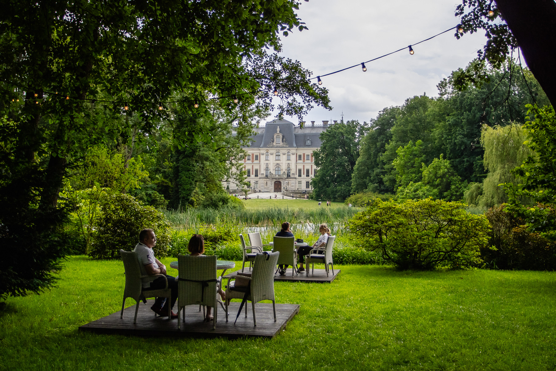 The outdoor tables offer a great setting with a view of the castle on the other side of the pond.
