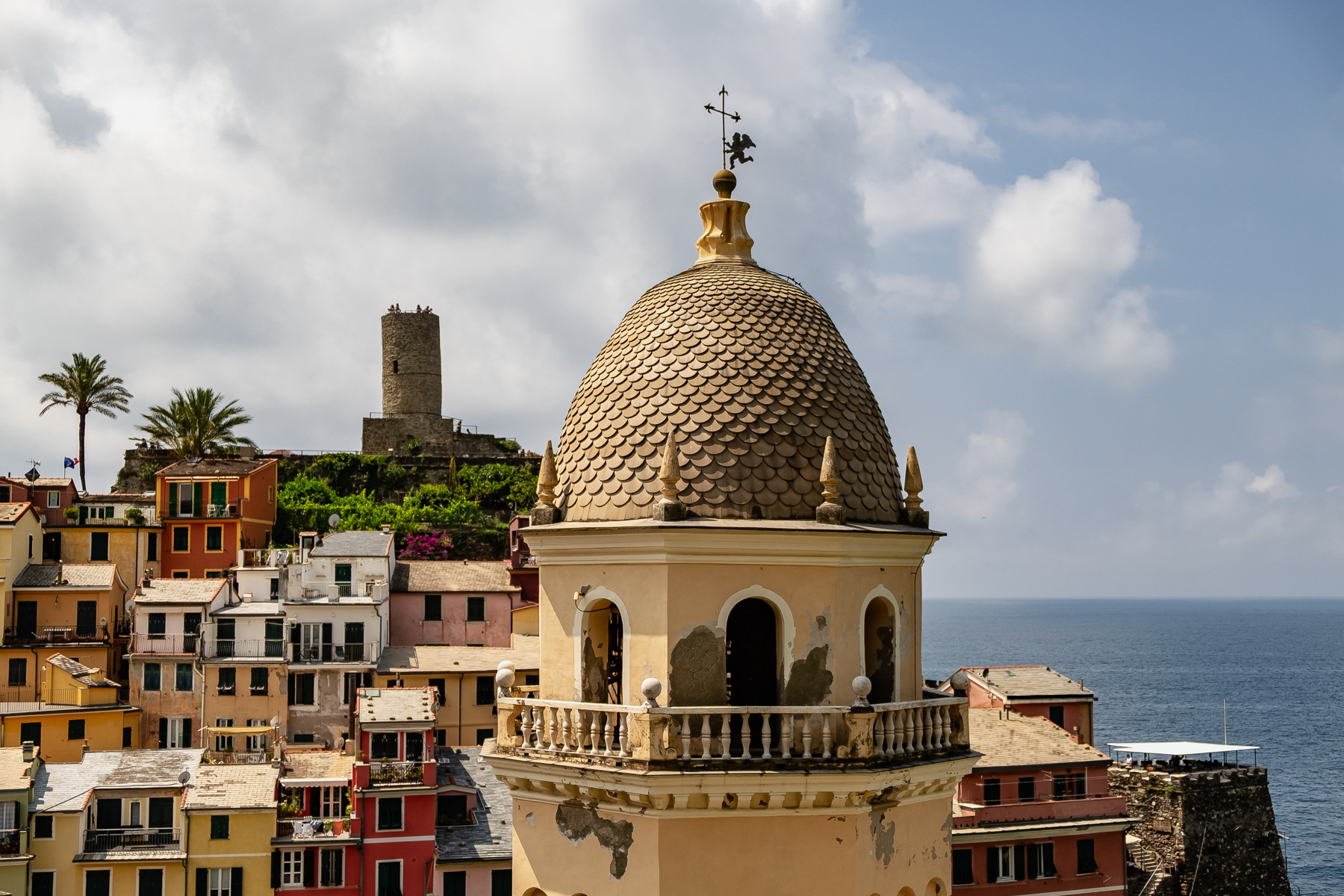 The tower of the church Chiesa di Santa Margherita, with the Vernazza castle in the background.