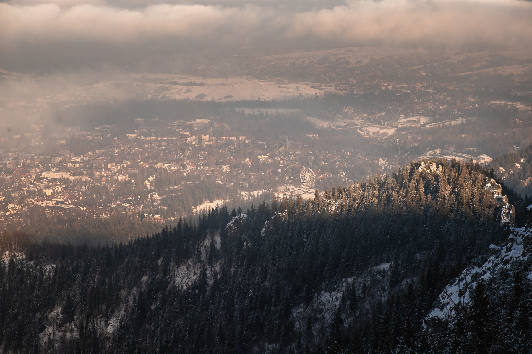 The ferris wheel in Zakopane is clearly visible from the peak