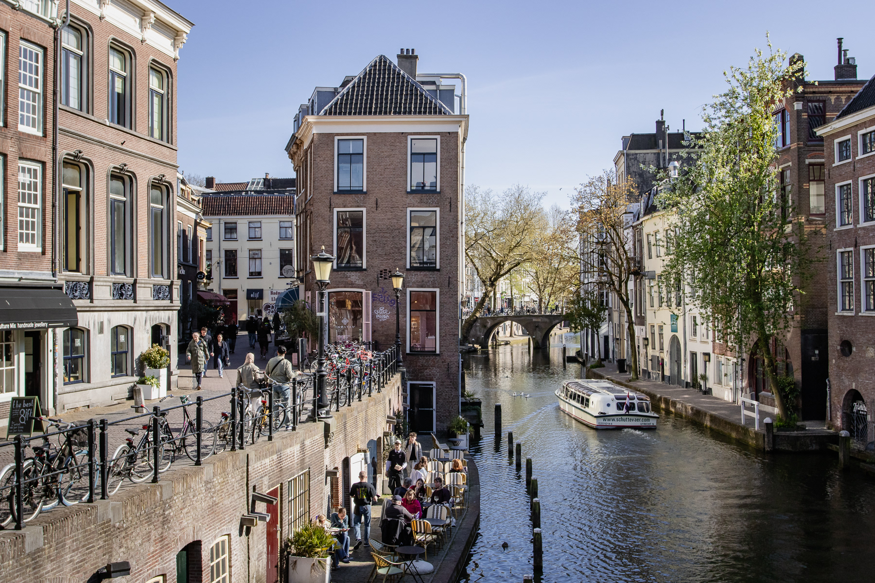 At the Oudegracht centre canal. Canal cruise boat and the Lichtegaard terraces.