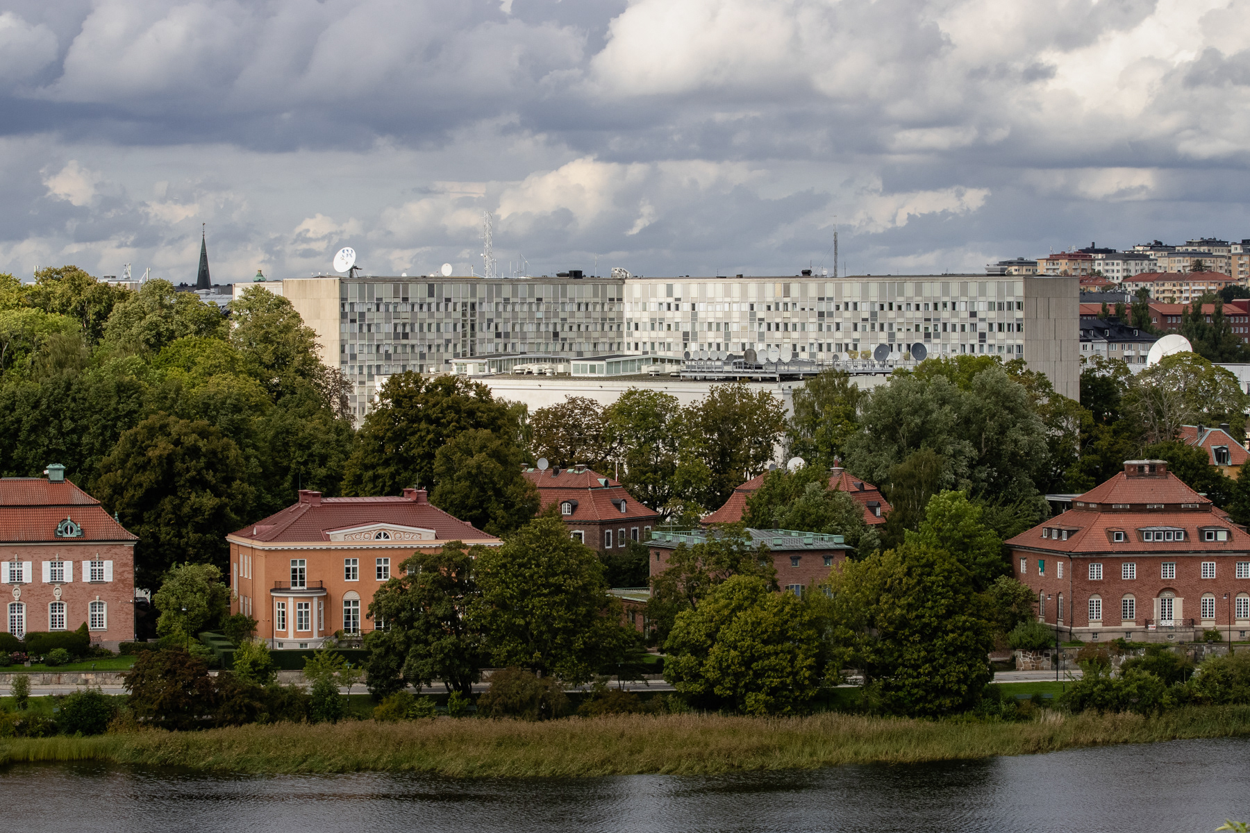 The building of Swedish Radio (SR) towering over embassies in fancy villas, September 2025.
