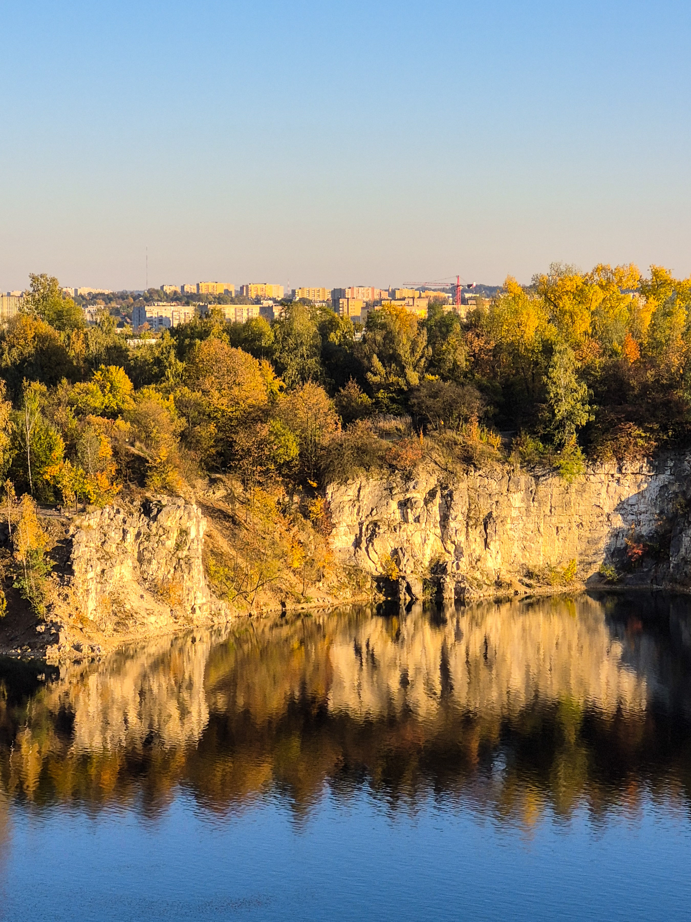 Autumn reflections of the quarry walls in the lake.