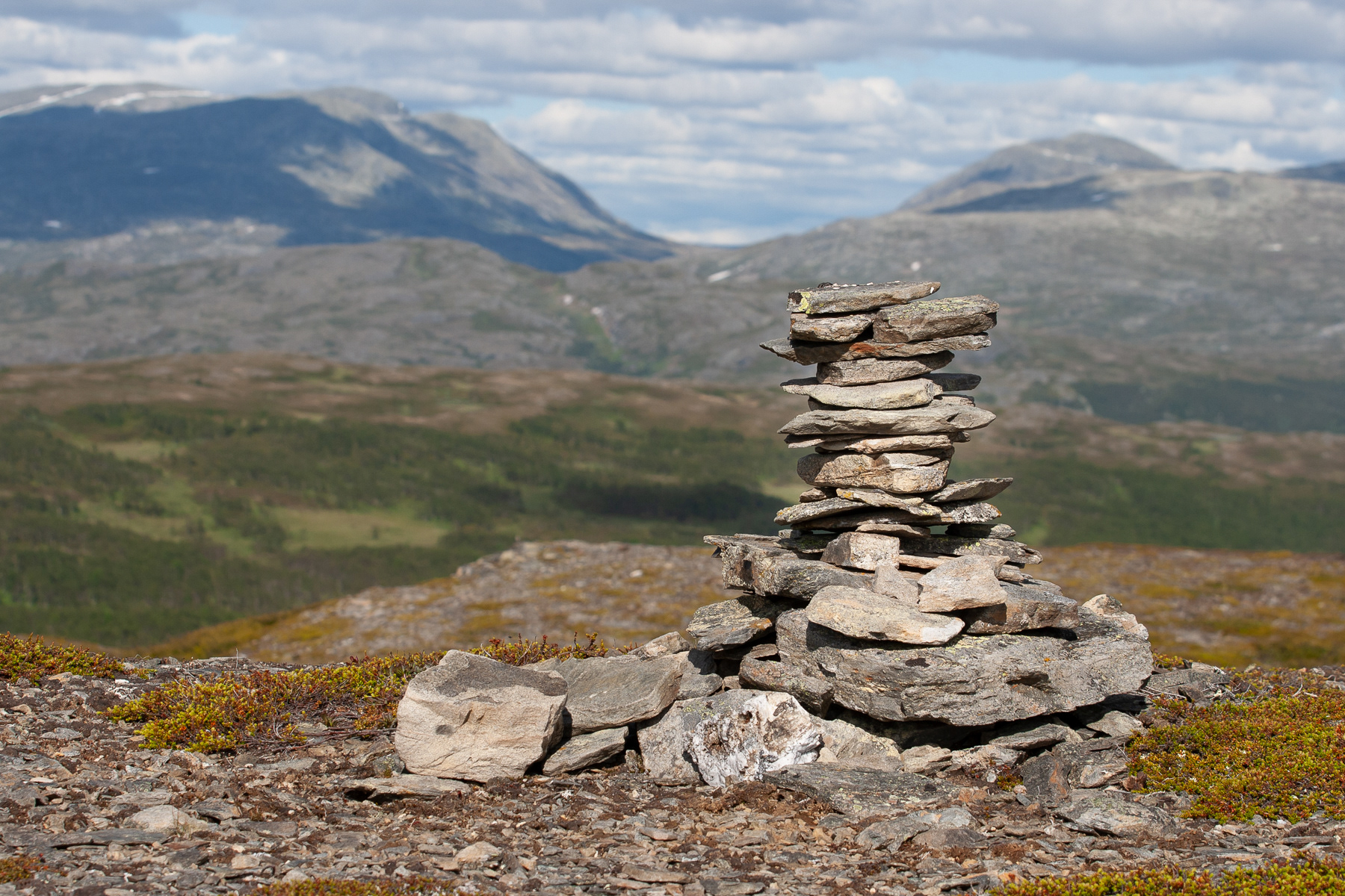 A pile of stones to give perspective to the high mountains in the background.