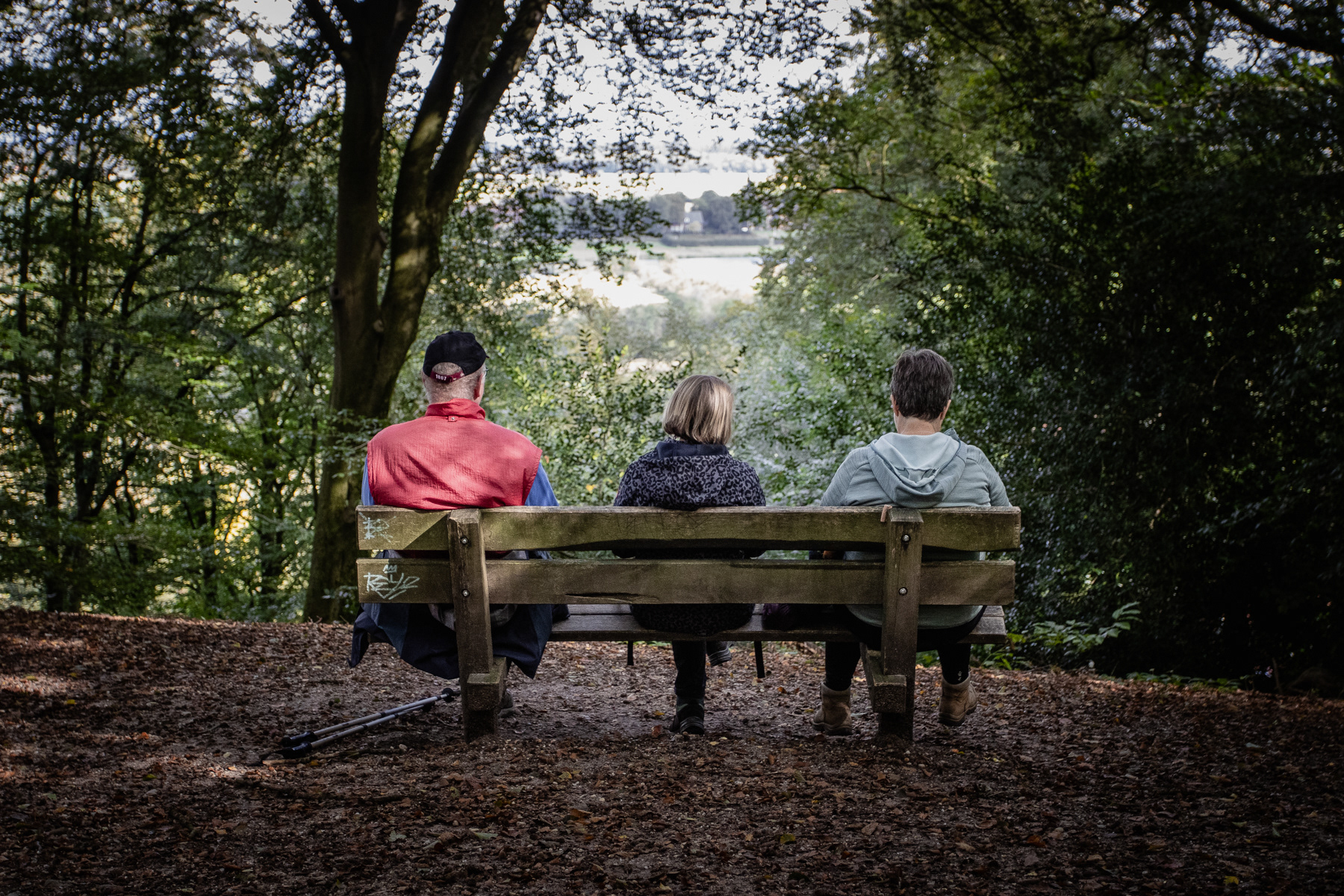 Three people on a bench