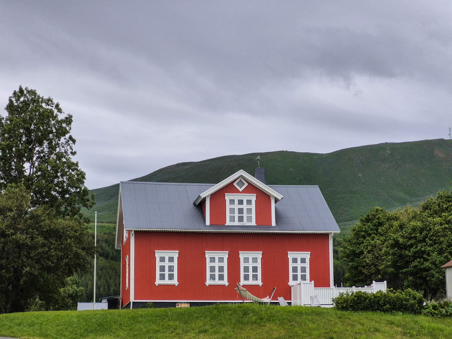 Another red house, this one higher up.