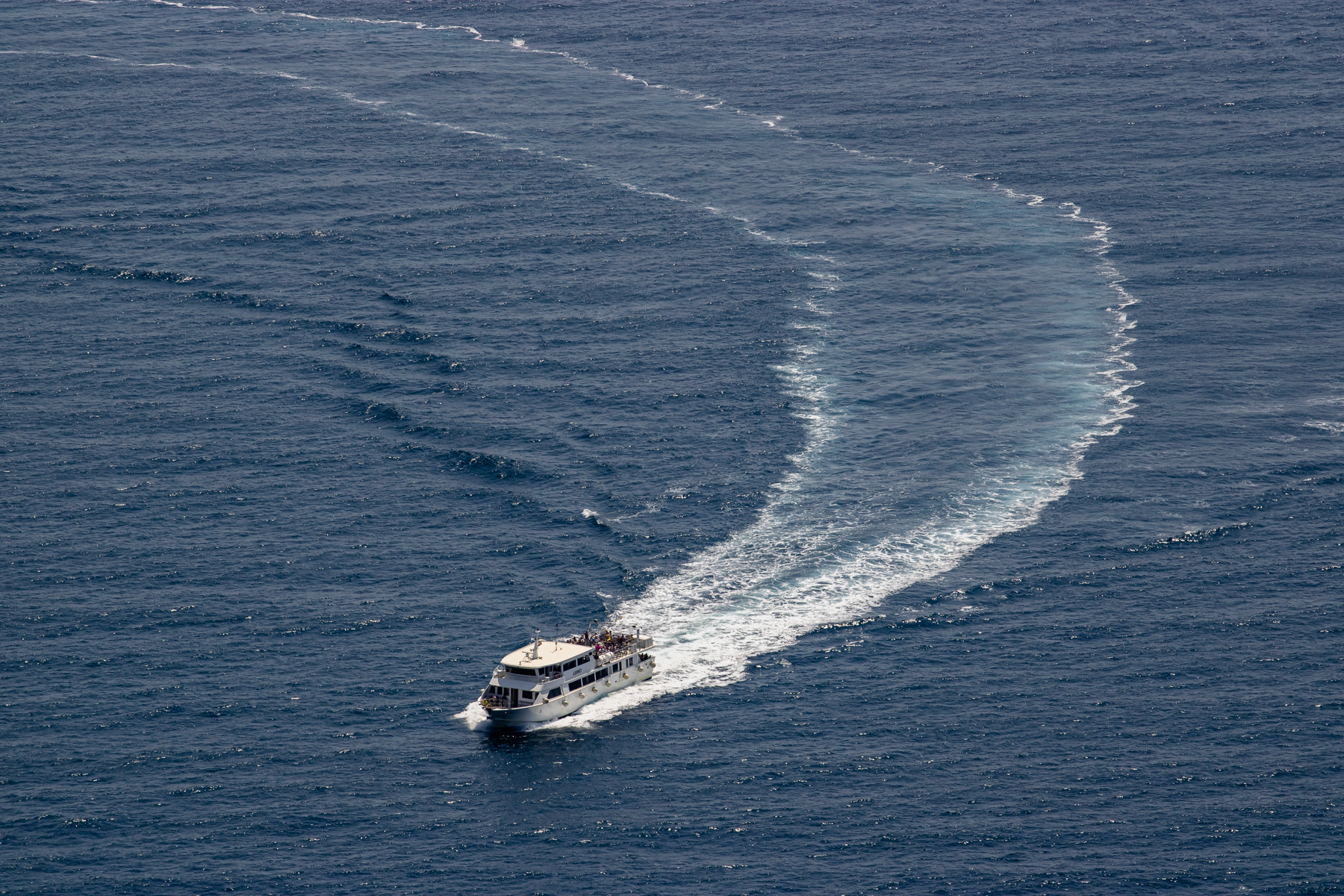 A tour boat heading to Riomaggiore.