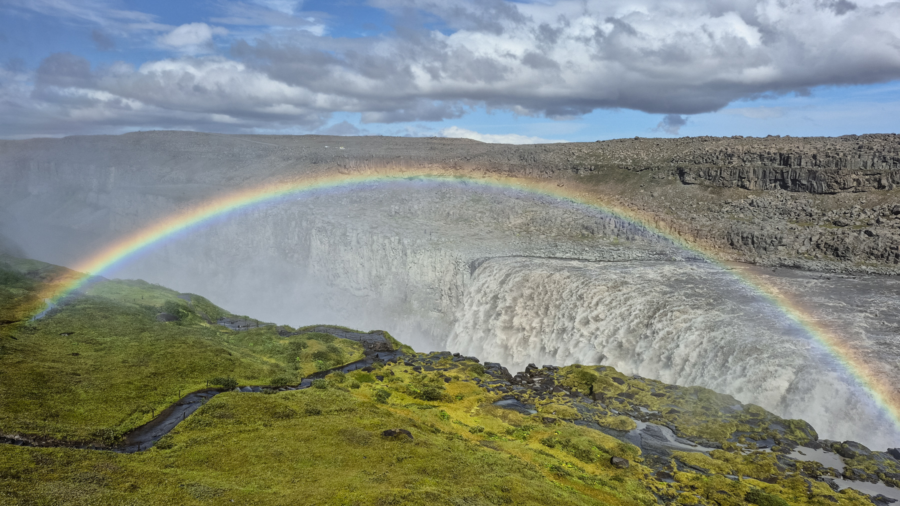 The Dettifoss waterfall on Iceland, July 2025. A rainbow formed over the waterfall.