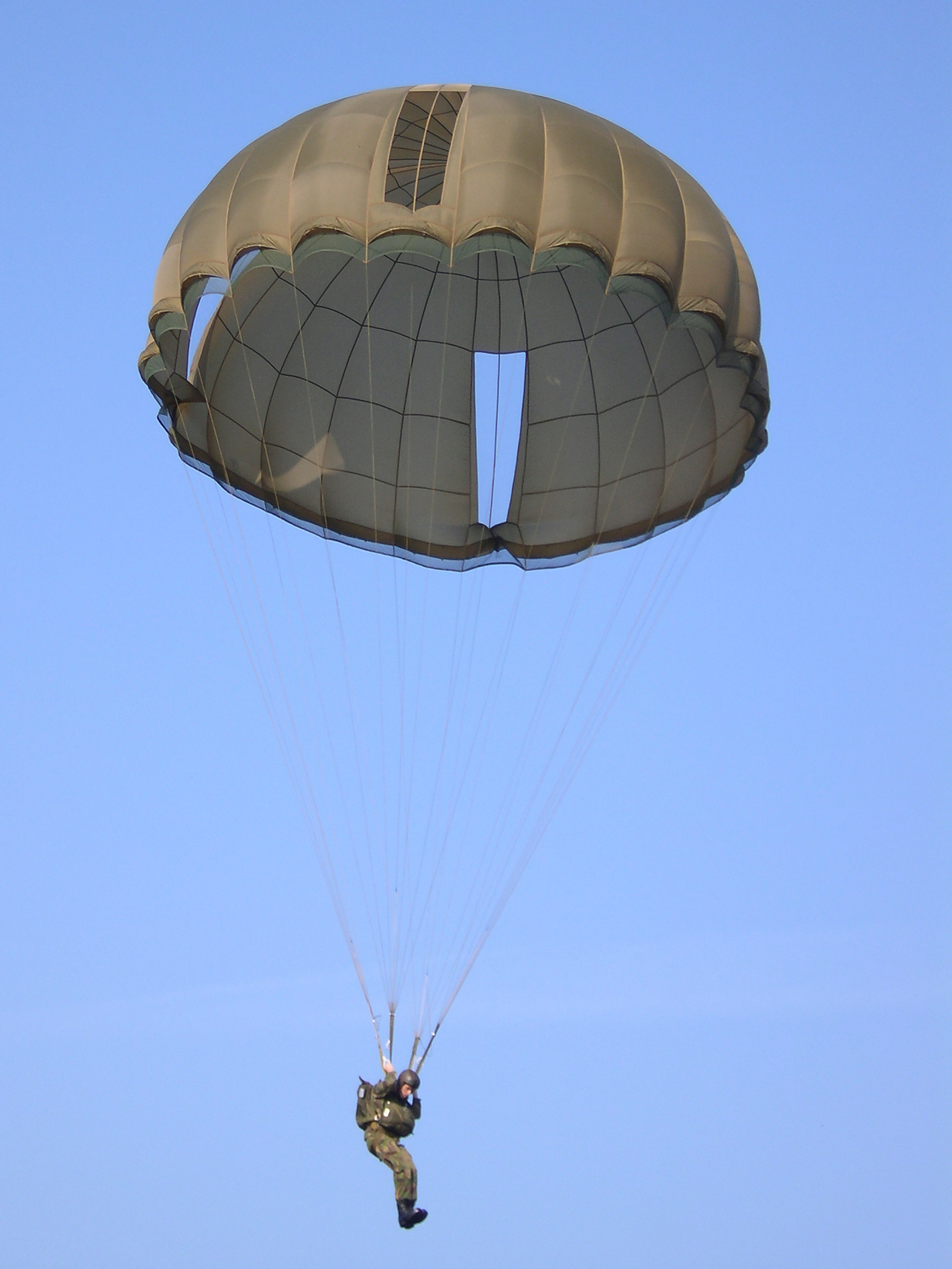 A paratrooper nearing the ground