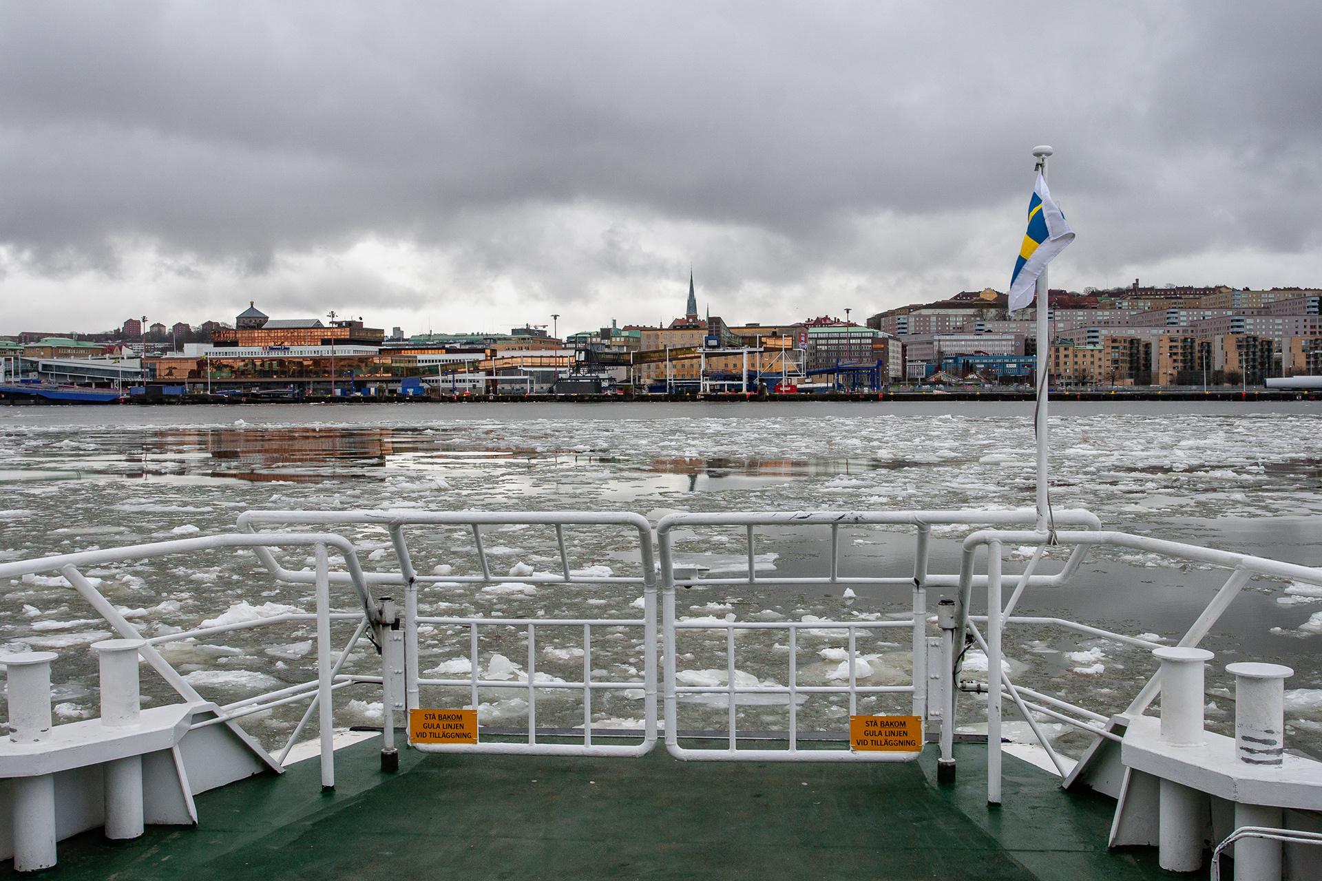 Facing the southern banks (city side) of the Göta river from the stearn of the Älvsnabben public transport river boat, February 2012.