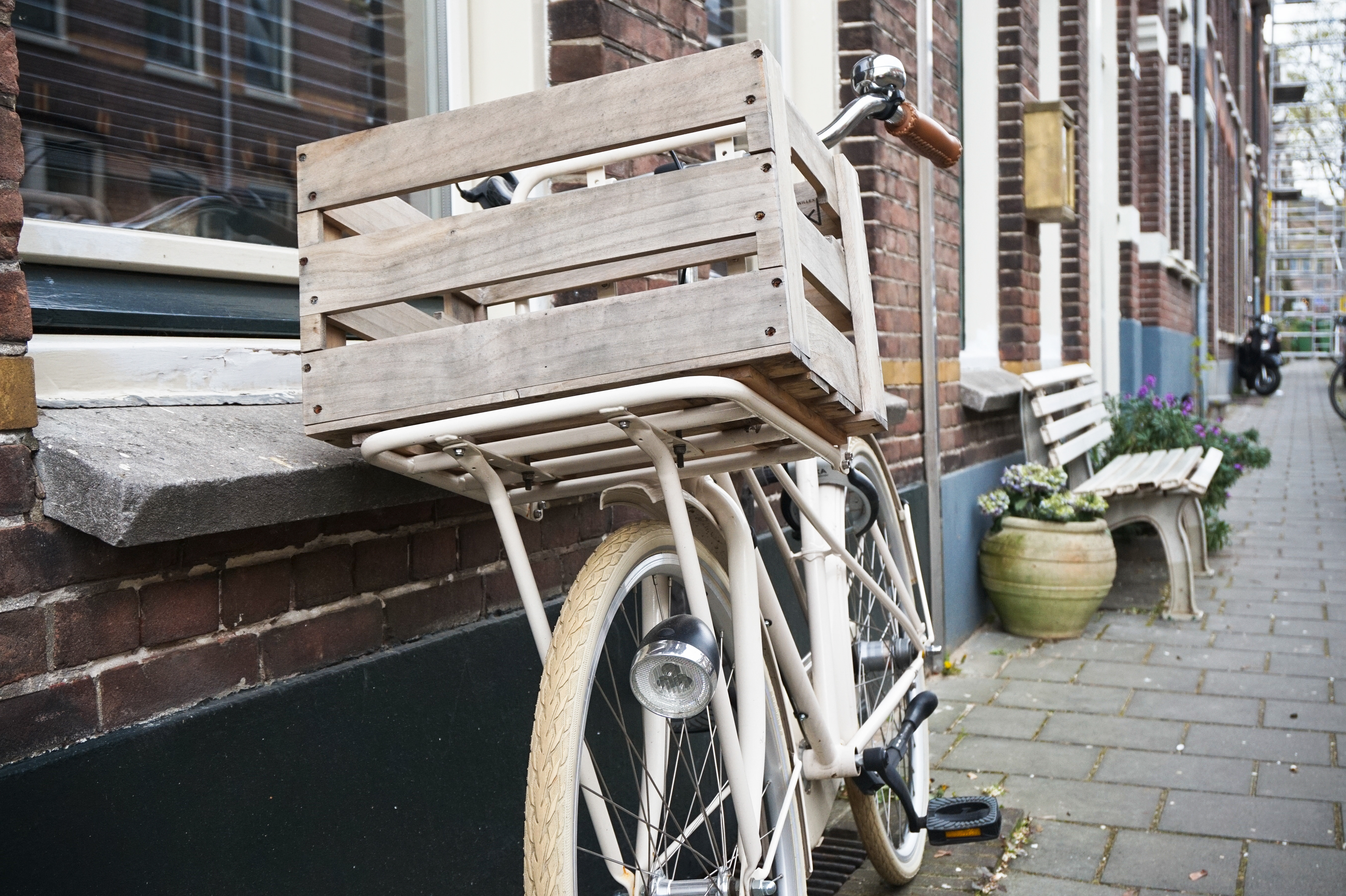 White bicycle with wooden cargo box