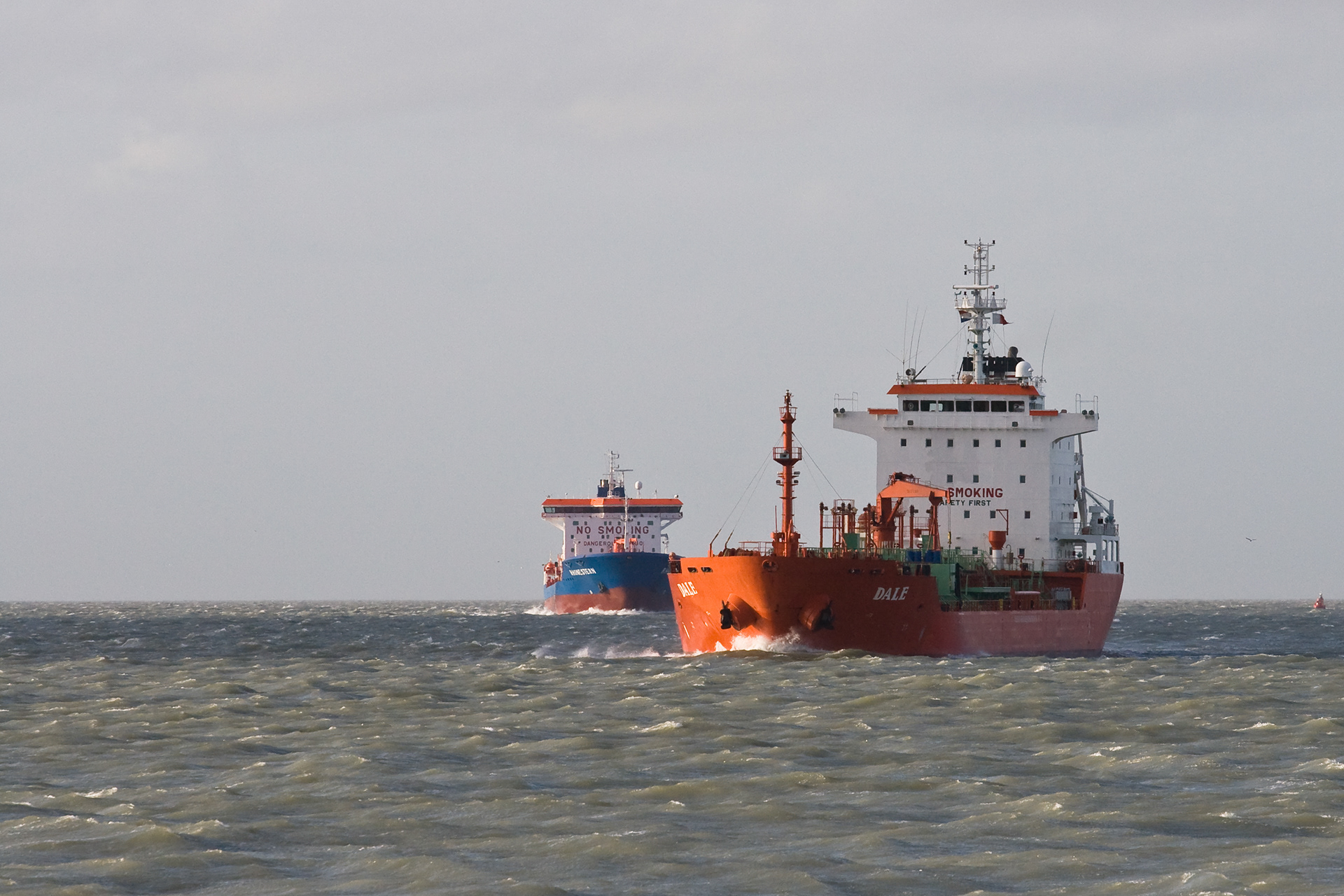 Two ocean going vessels heading towards the harbours of Zeeland and Antwerp. In front the Dale.