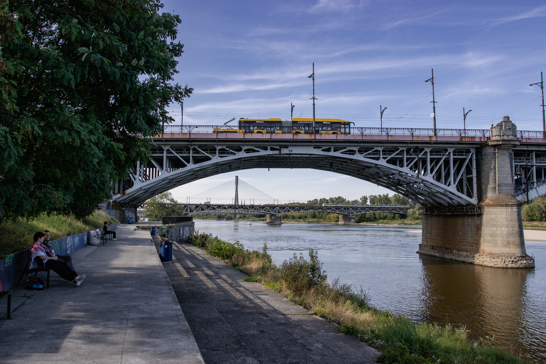 The Poniatowski Bridge (Most Poniatowskiego) in the forefront, with the Średnicowy Railroad Bridge and the Świętokrzyski Bridge Hang Bridge further away, August 2025.